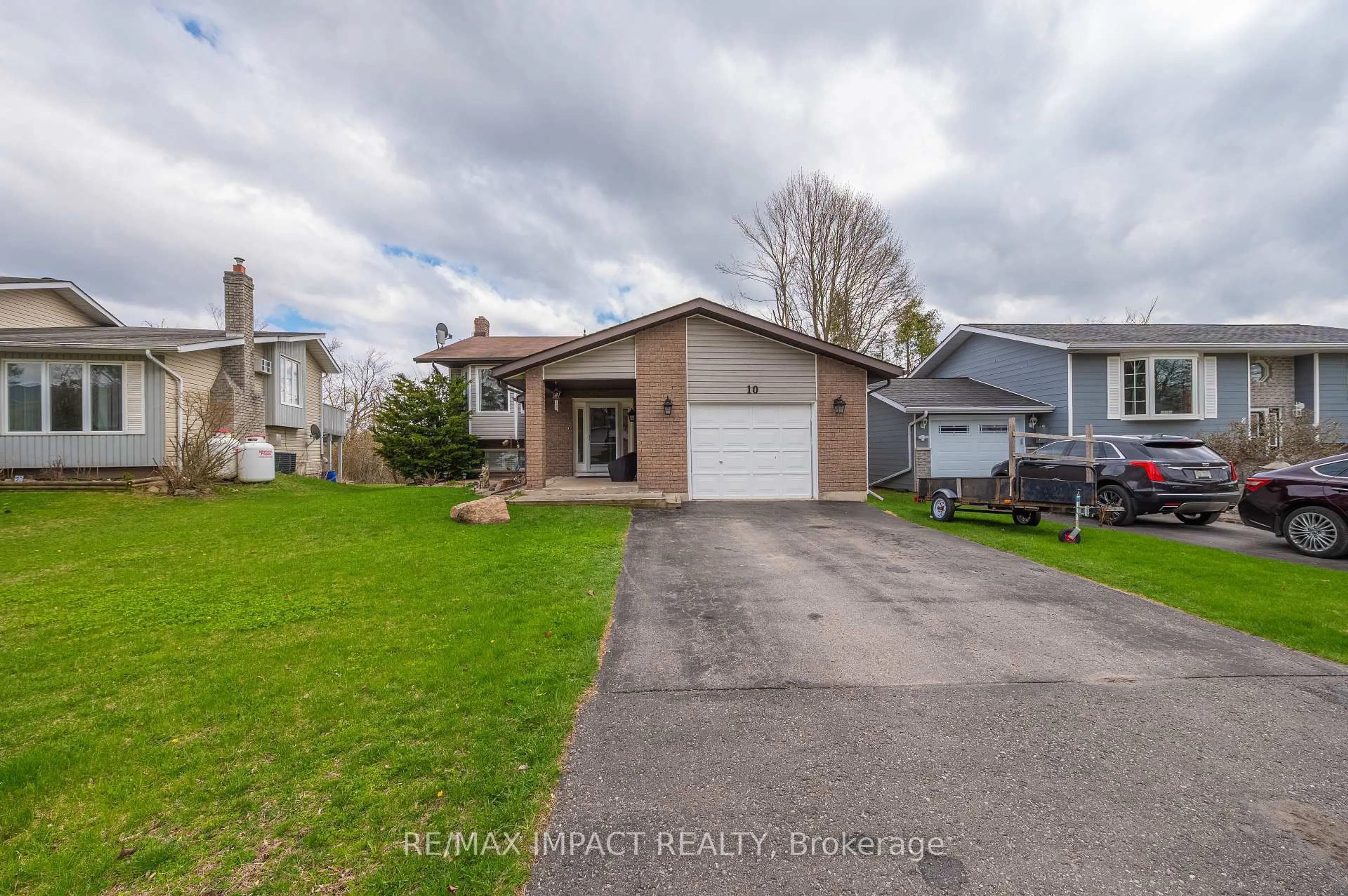 A pic from outside/outdoor area/front of a property/back of a property/a pic from drone, street for 10 Cedartree Lane, Kawartha Lakes Ontario K0M 1A0