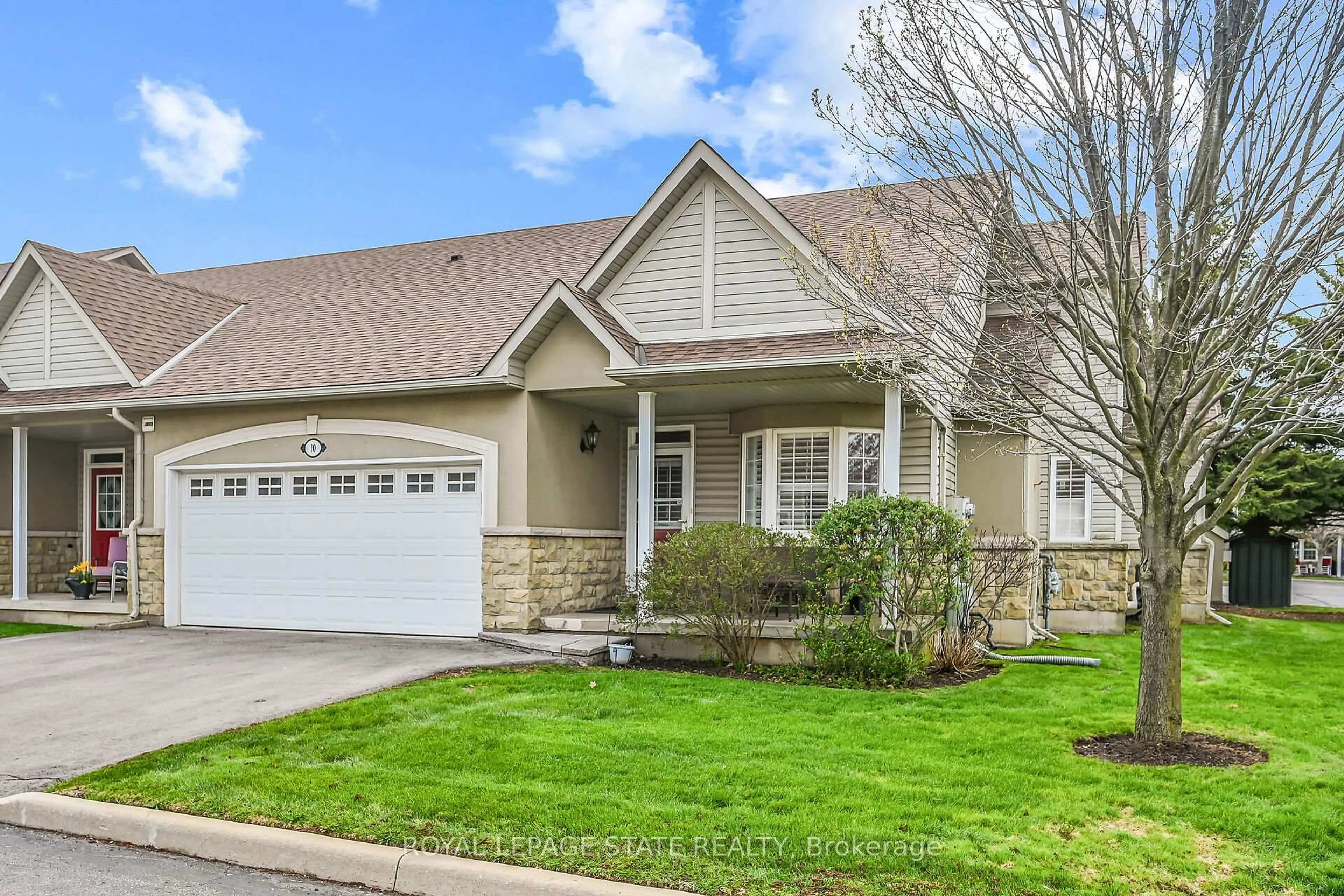 Home with vinyl exterior material, street for 212 Stonehenge Dr #10, Hamilton Ontario L9K 1N5
