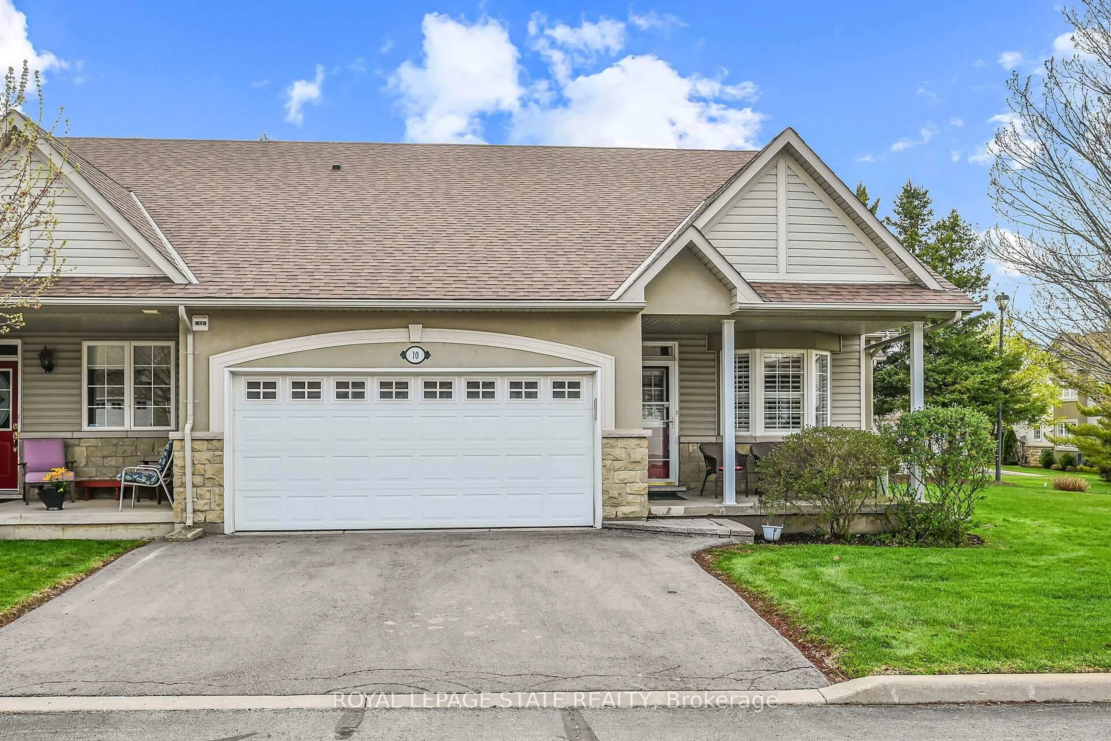 Home with vinyl exterior material, street for 212 Stonehenge Dr #10, Hamilton Ontario L9K 1N5