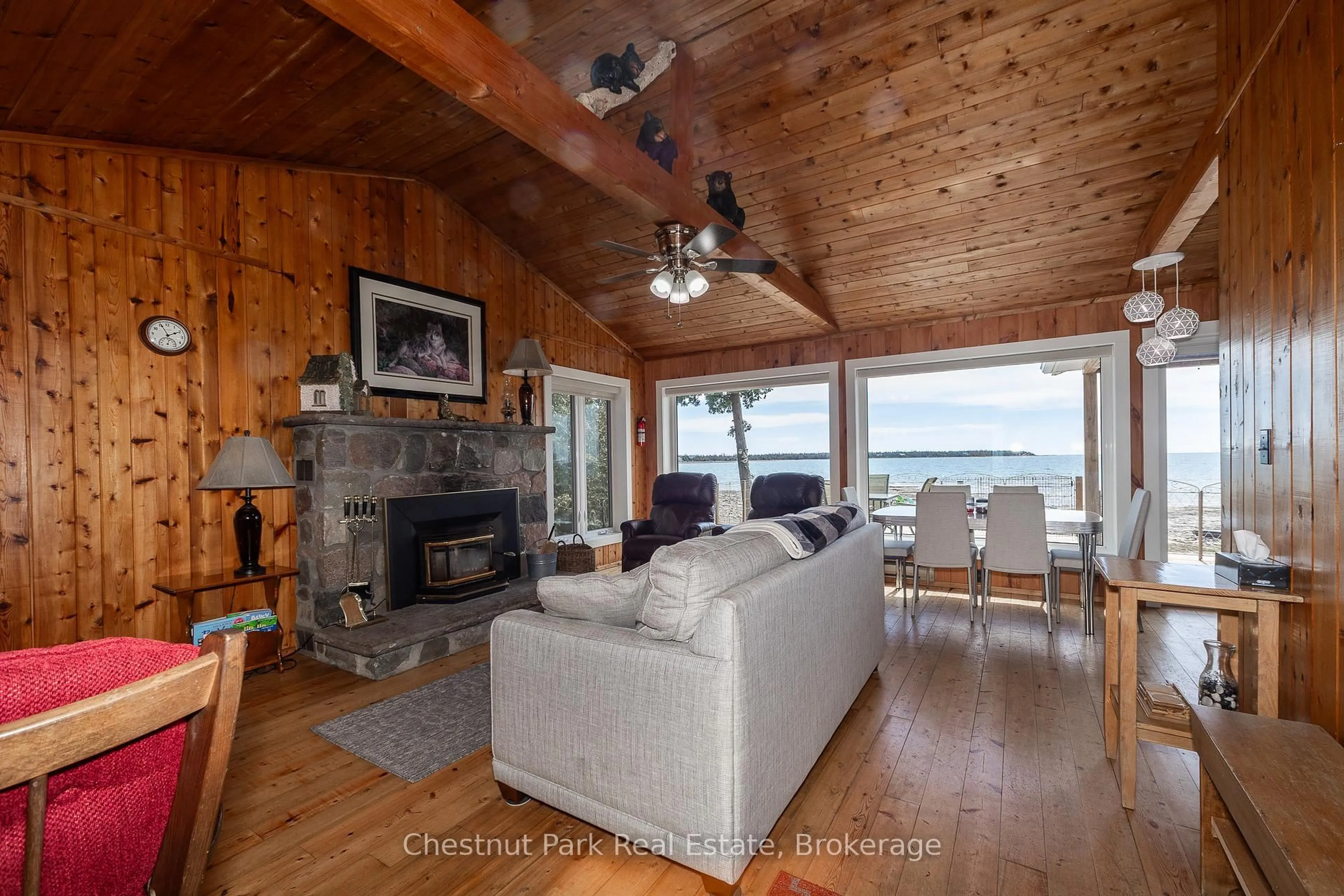 Living room with furniture, wood/laminate floor for 19 Indian Harbour Rd, Northern Bruce Peninsula Ontario N0H 2R0