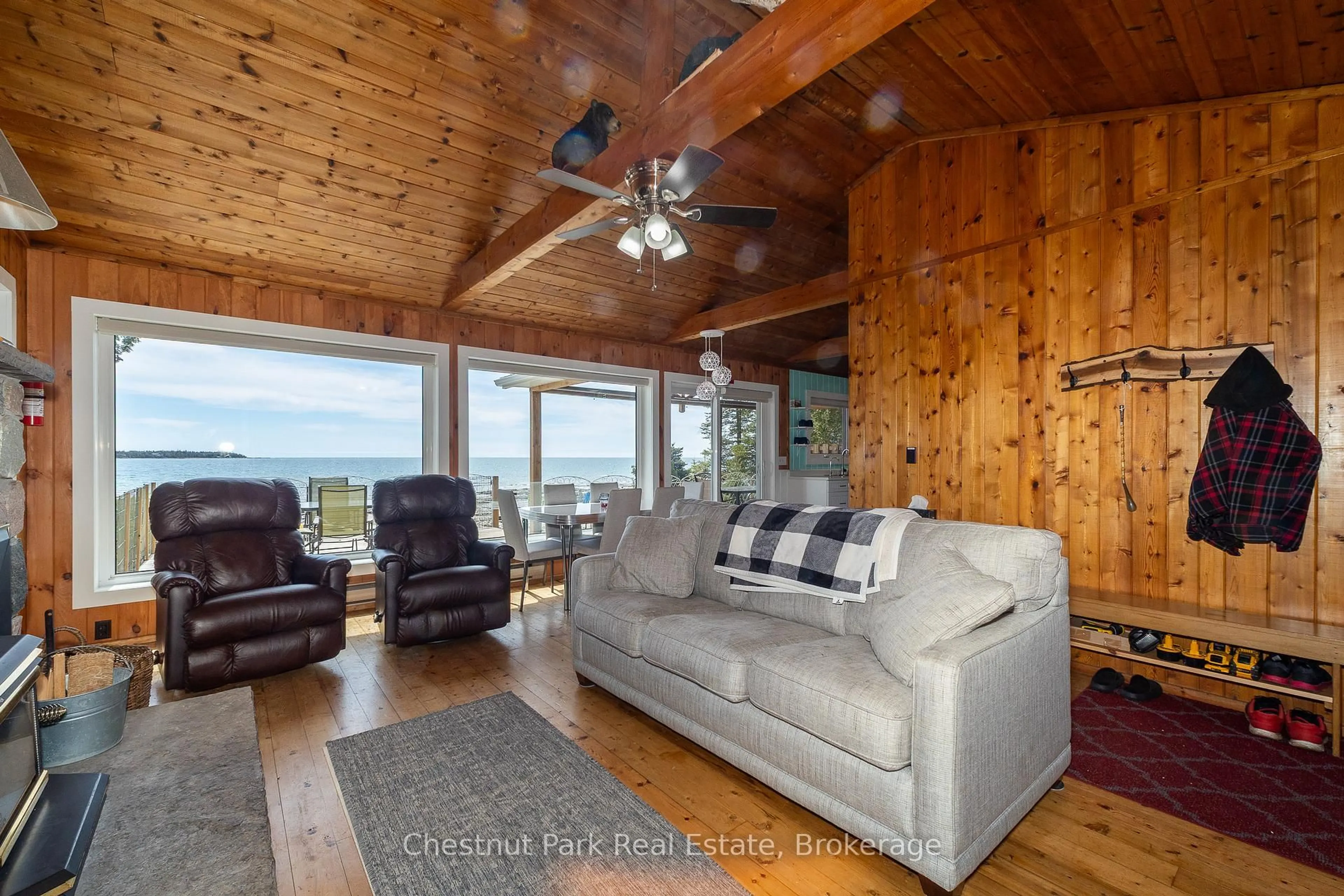 Living room with furniture, wood/laminate floor for 19 Indian Harbour Rd, Northern Bruce Peninsula Ontario N0H 2R0