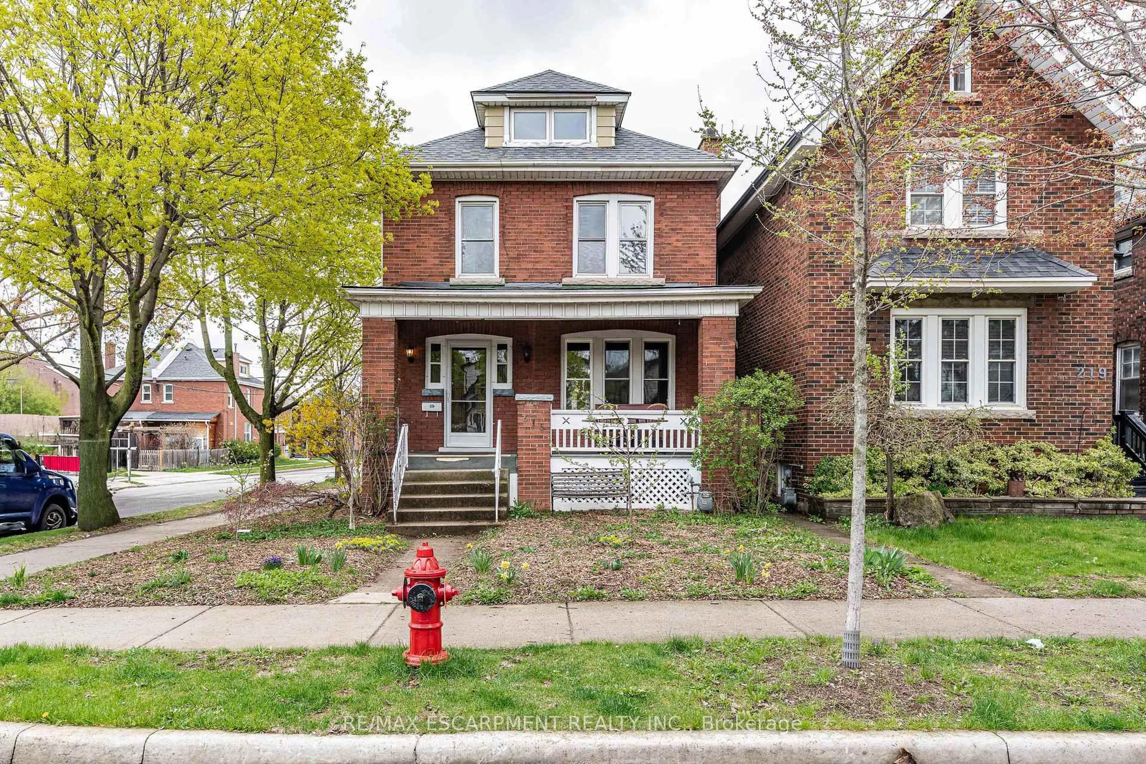 Home with brick exterior material, street for 215 London St, Hamilton Ontario L8K 2H1