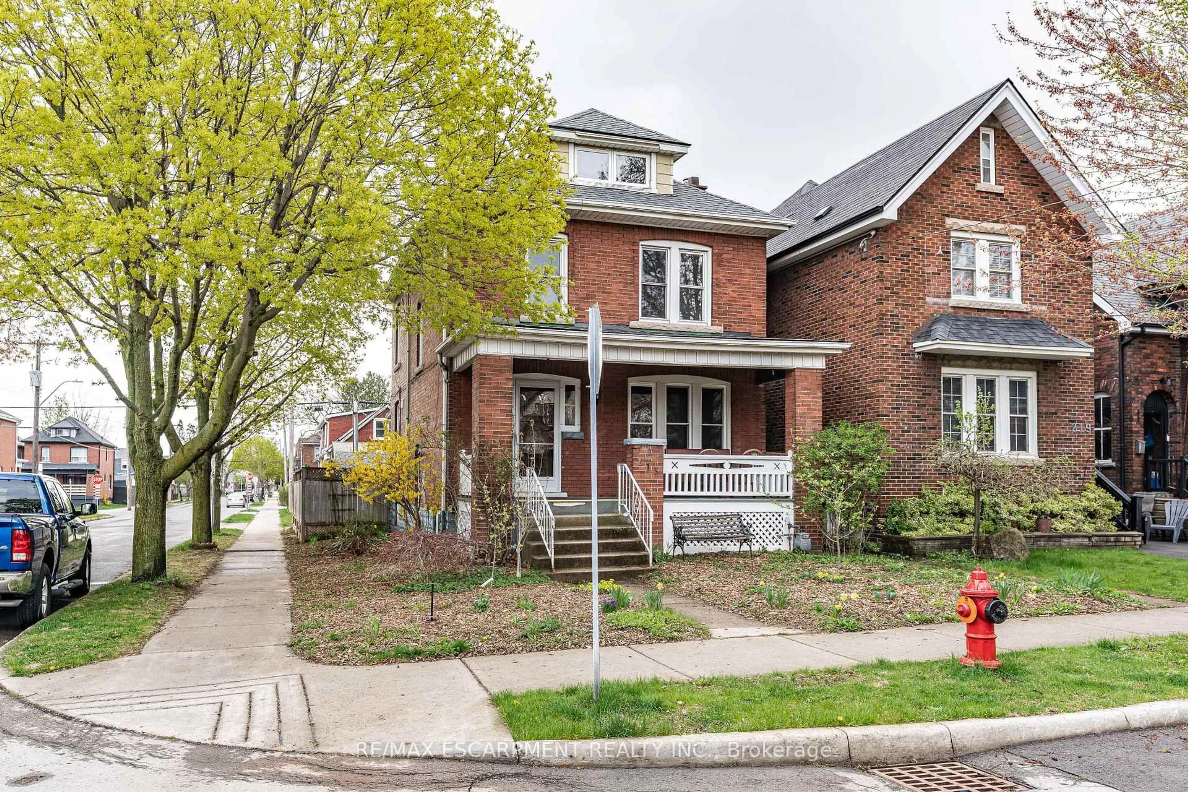 Home with brick exterior material, street for 215 London St, Hamilton Ontario L8K 2H1