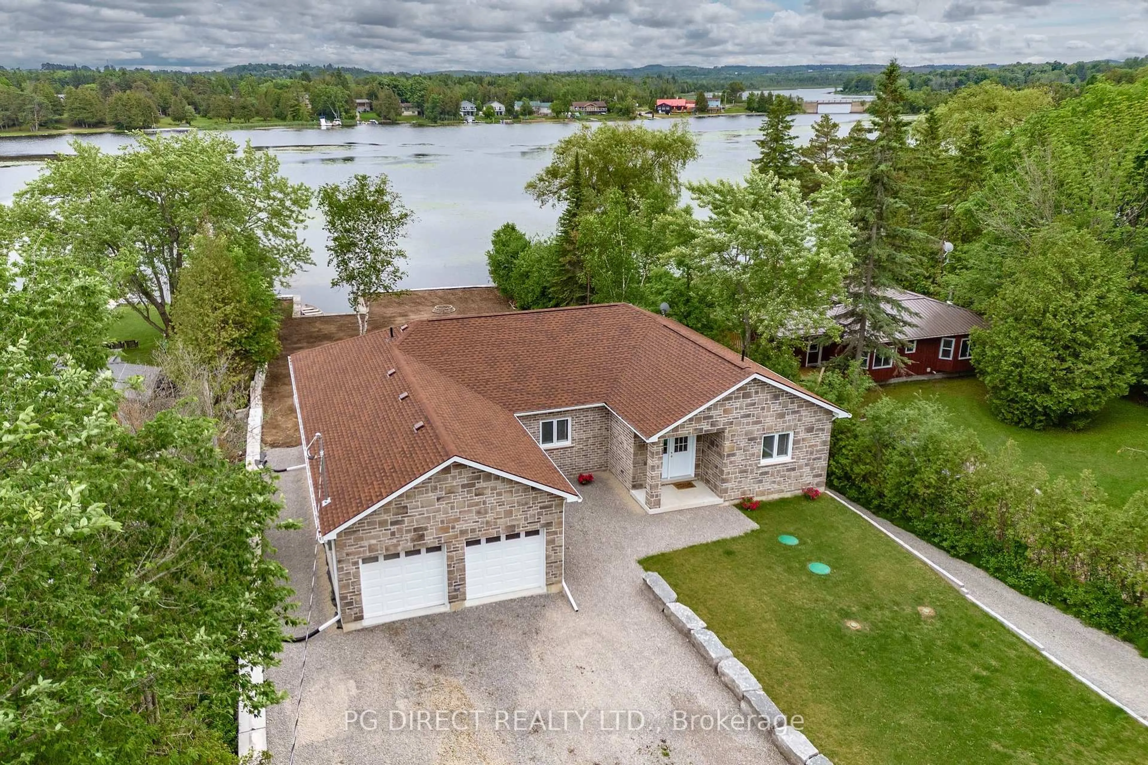 A pic from outside/outdoor area/front of a property/back of a property/a pic from drone, water/lake/river/ocean view for 12 Evergreen St, Kawartha Lakes Ontario K0L 2W0