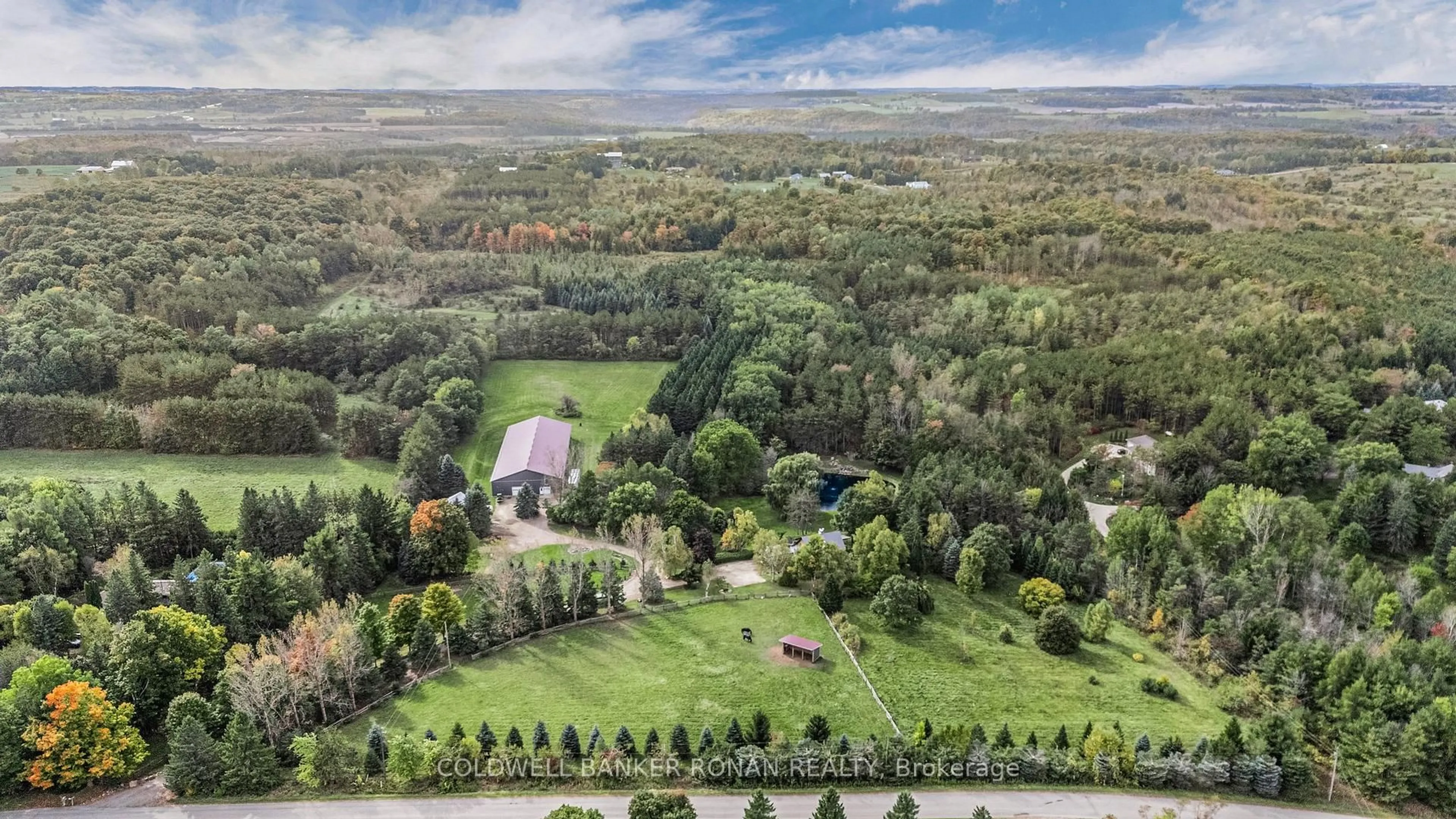 A pic from outside/outdoor area/front of a property/back of a property/a pic from drone, forest/trees view for 836138 4th Line, Mulmur Ontario L9V 0J1