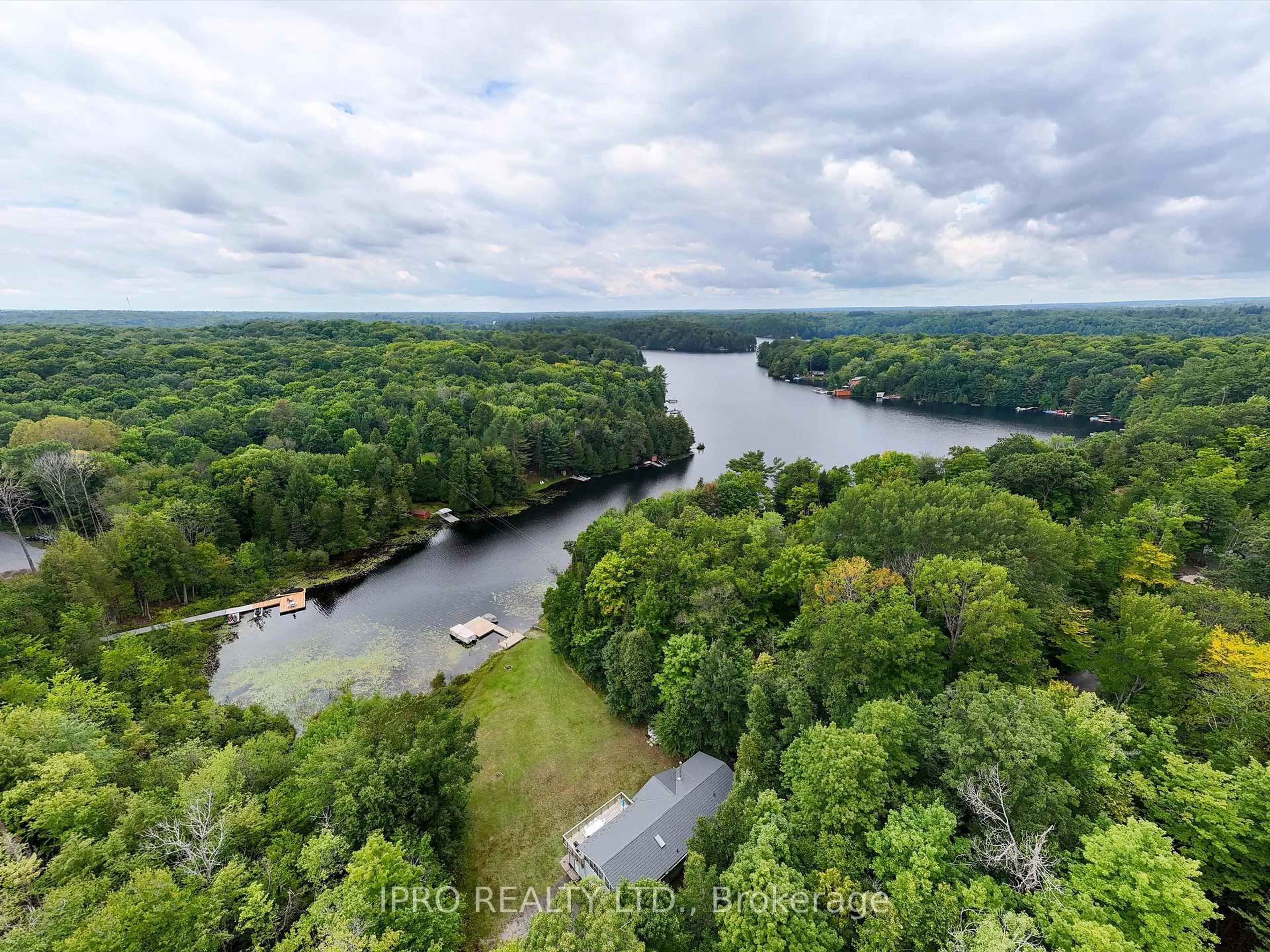 A pic from outside/outdoor area/front of a property/back of a property/a pic from drone, water/lake/river/ocean view for 6 Lower Lane, Seguin Ontario P2A 2W8