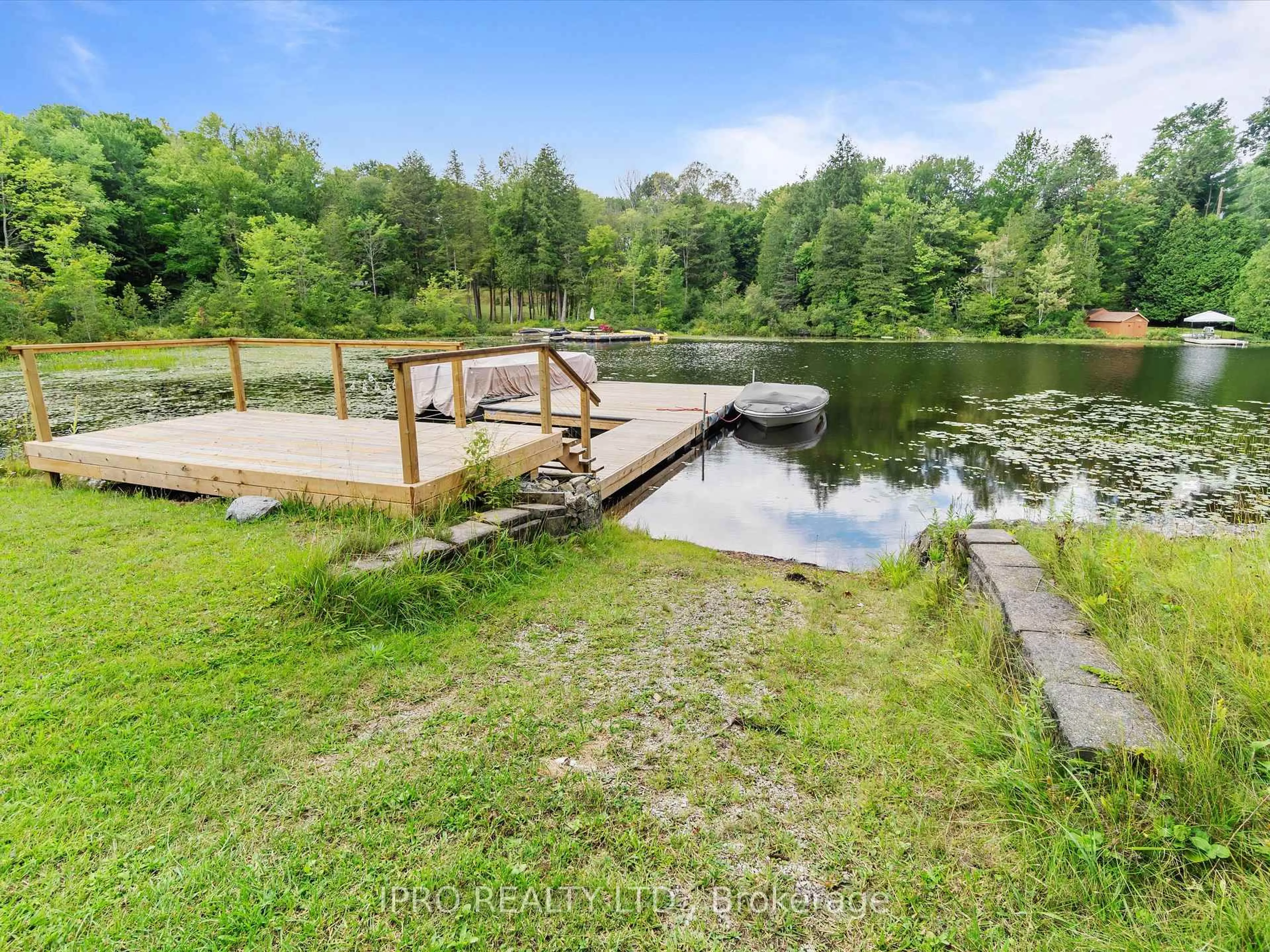 A pic from outside/outdoor area/front of a property/back of a property/a pic from drone, water/lake/river/ocean view for 6 Lower Lane, Seguin Ontario P2A 2W8