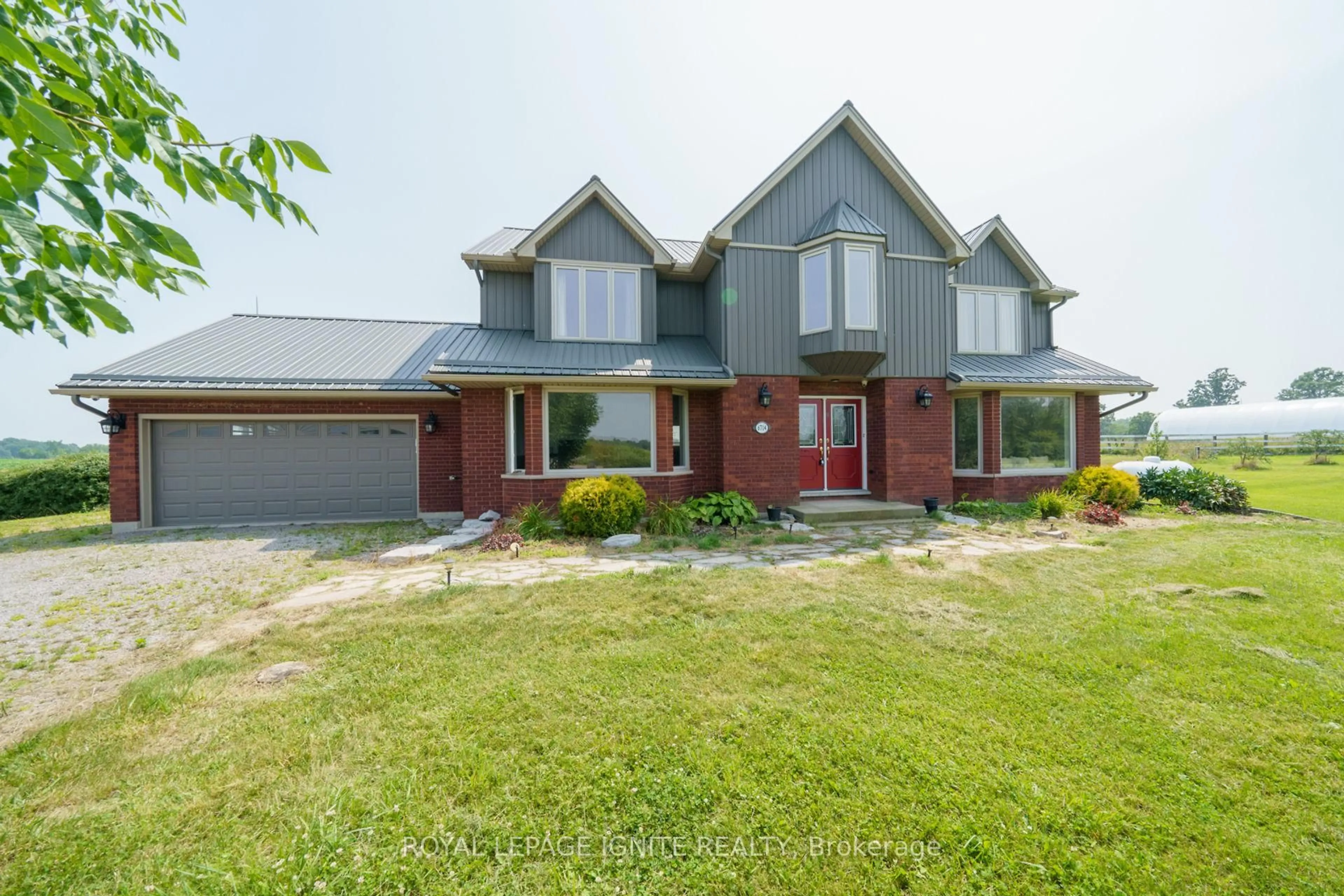 Home with brick exterior material, street for 6714 Regional Rd #65, West Lincoln Ontario L0R 1Y0
