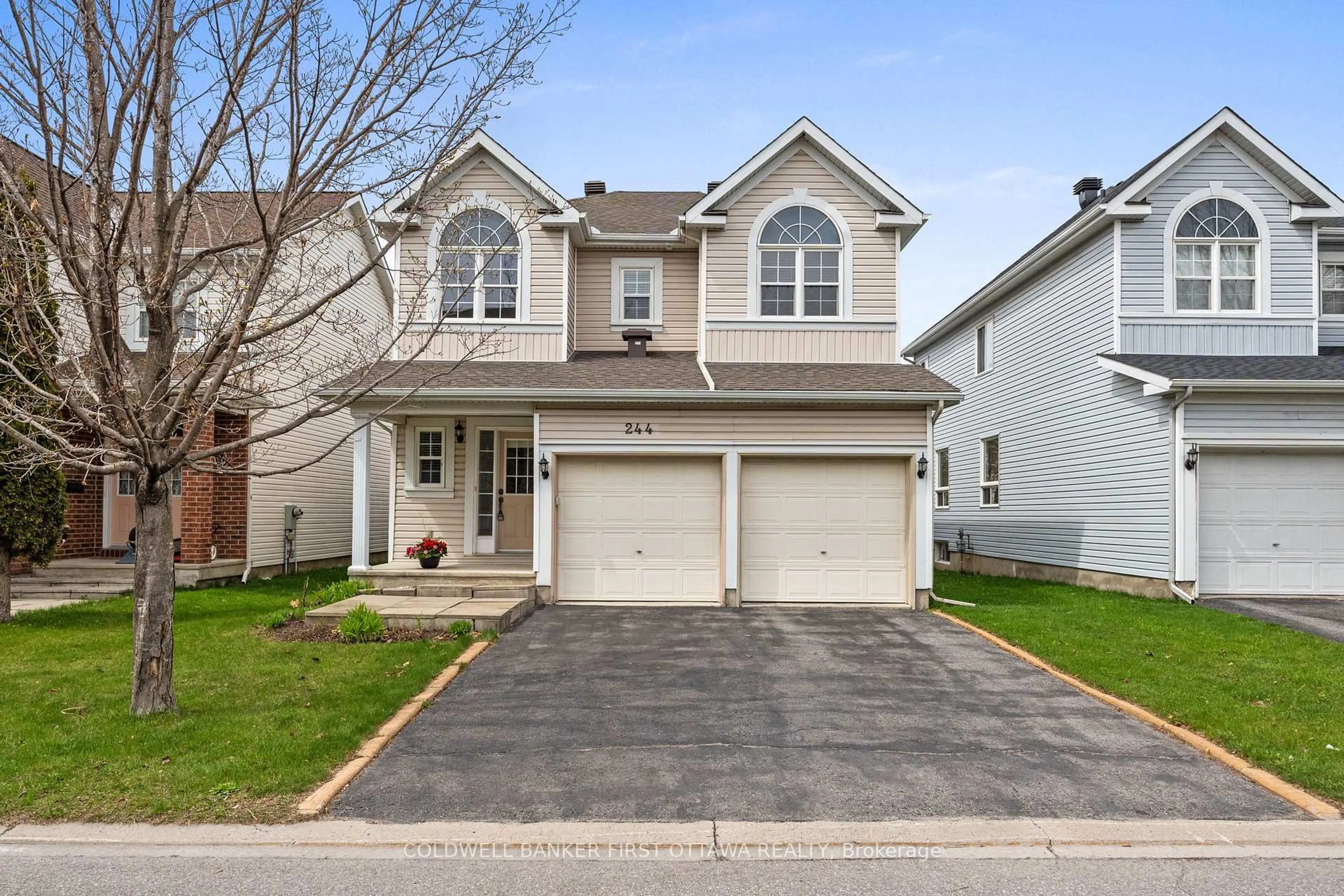 Home with vinyl exterior material, street for 244 Deercroft Ave, Ottawa Ontario K2J 5J9