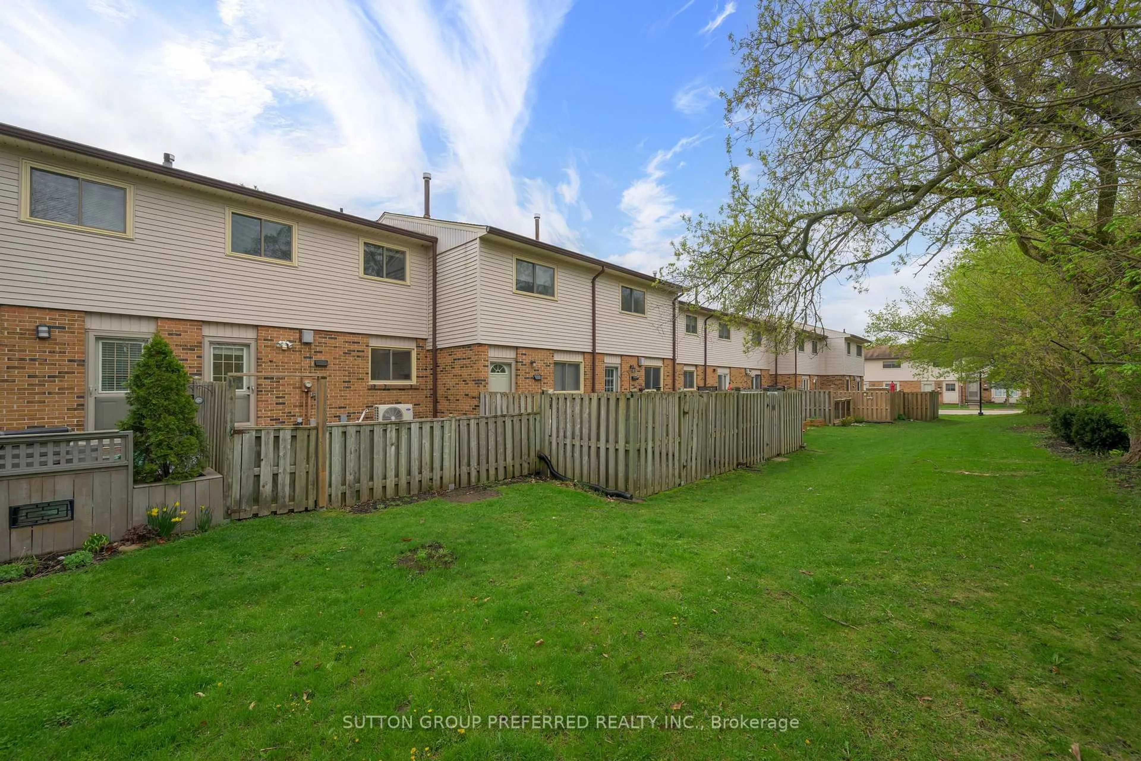 A pic from outside/outdoor area/front of a property/back of a property/a pic from drone, street for 1328 Commissioners Rd #6, London South Ontario N6K 2Y6
