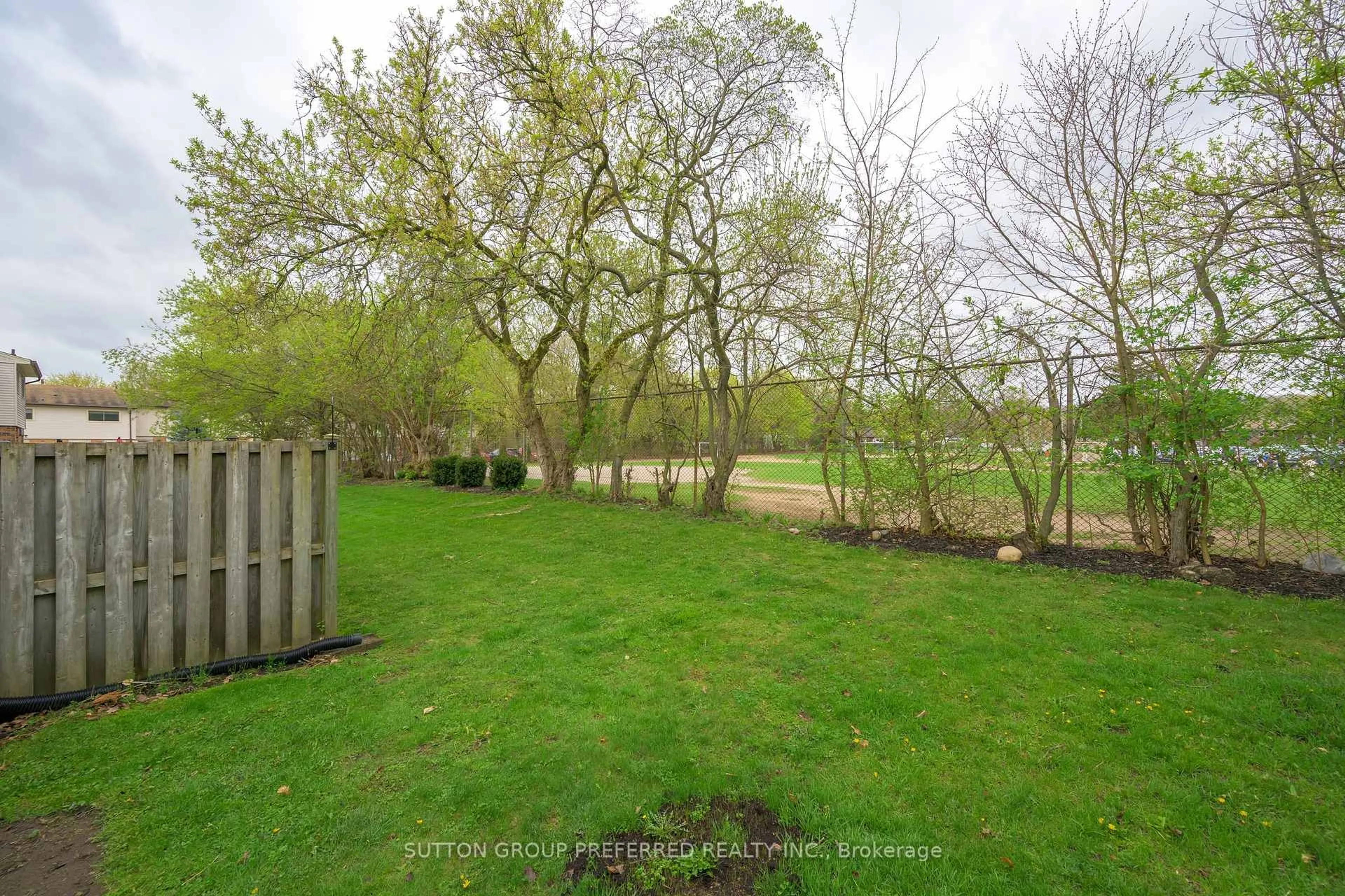 A pic from outside/outdoor area/front of a property/back of a property/a pic from drone, forest/trees view for 1328 Commissioners Rd #6, London South Ontario N6K 2Y6