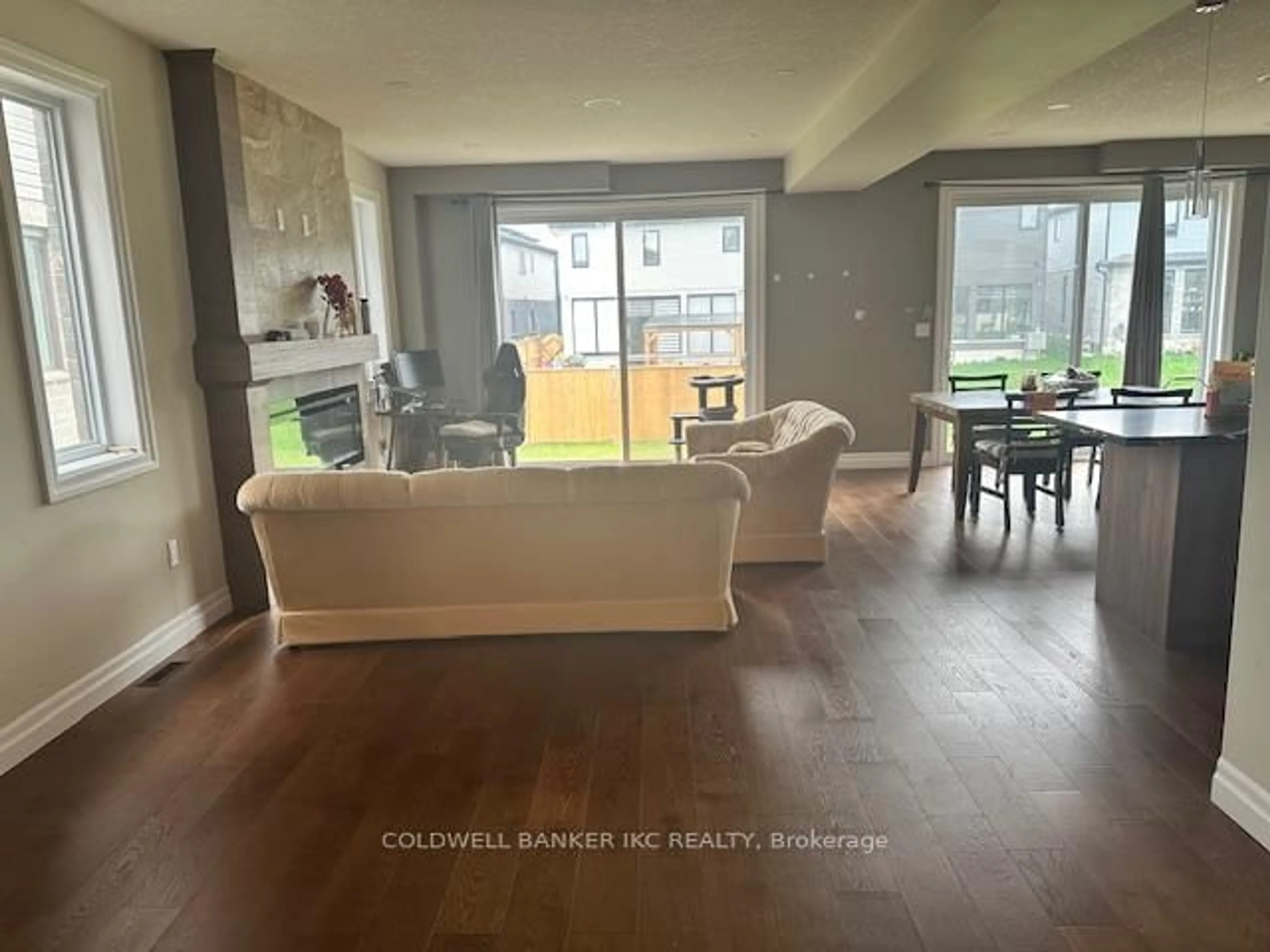 Living room with furniture, wood/laminate floor for 600 Chelton Rd, London South Ontario N6M 0H7