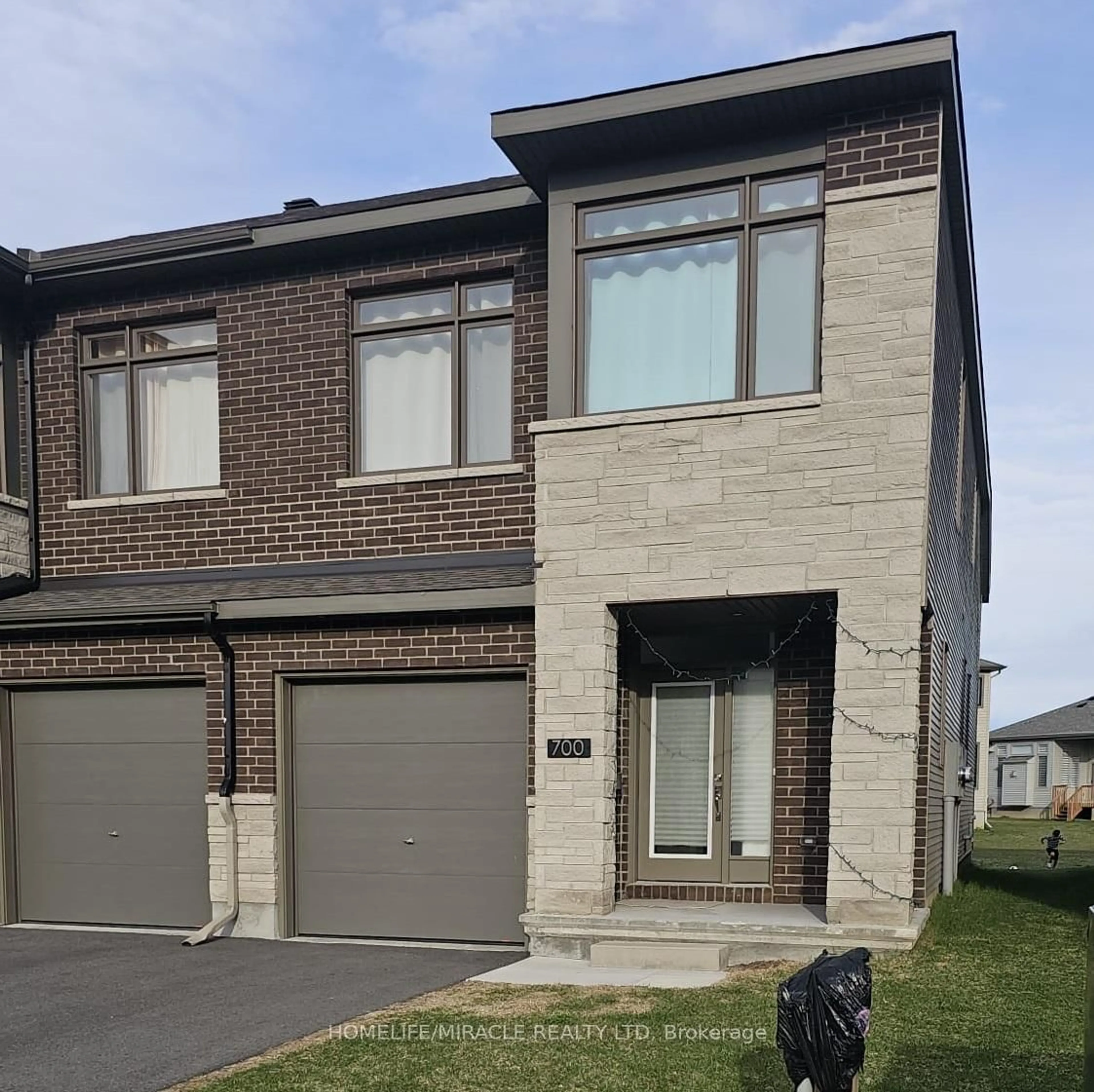 Home with brick exterior material, street for 700 Miikana Rd, Ottawa Ontario K1X 0H7