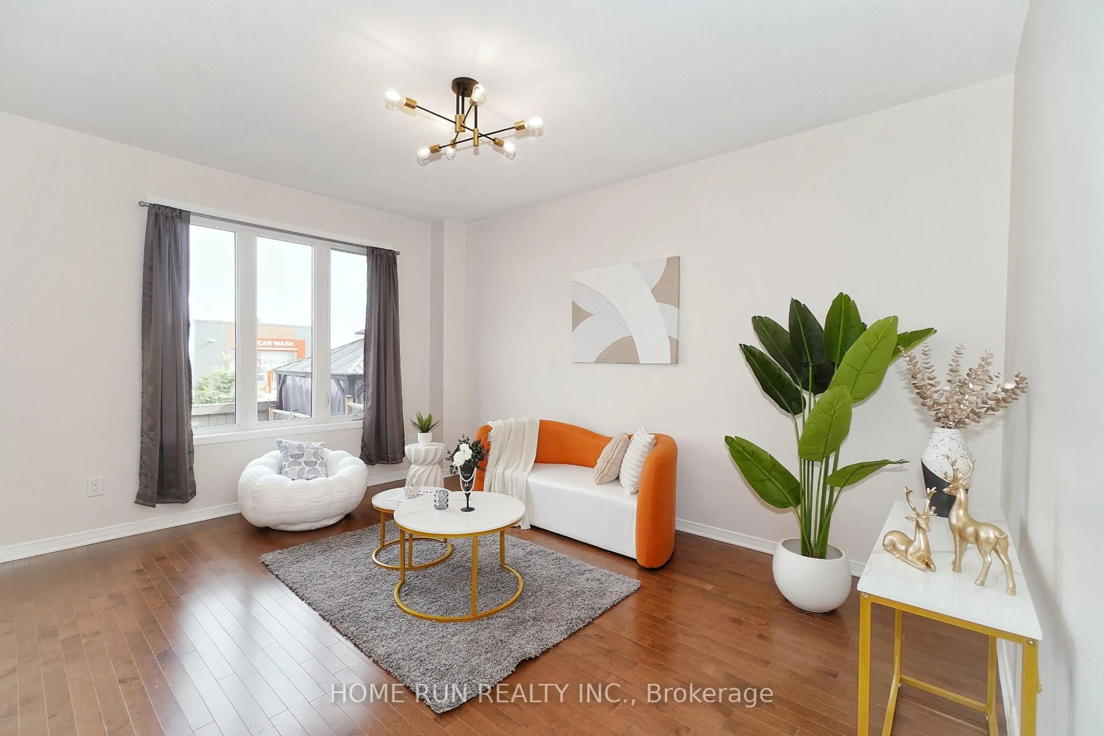 Living room with furniture, wood/laminate floor for 224 Don Brown Private, Ottawa Ontario K2M 0M6