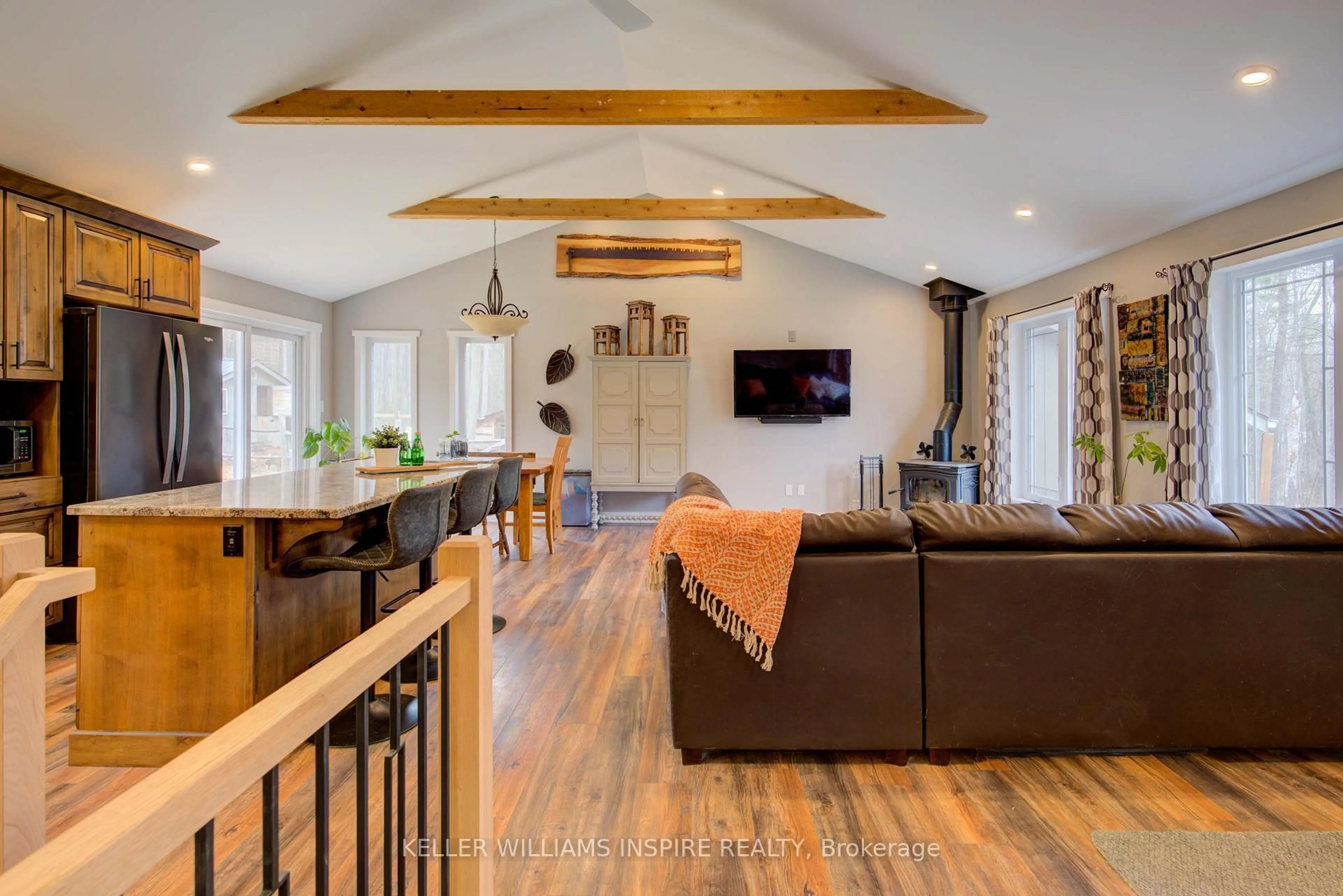Living room with furniture, wood/laminate floor for 23 Bird Rd, Stirling Ontario K0K 3E0
