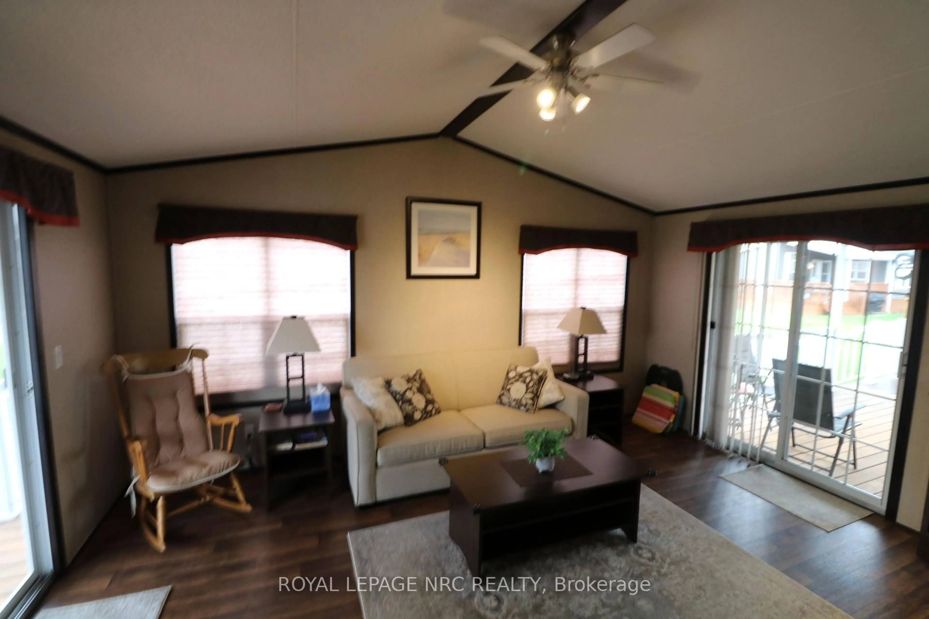 Living room with furniture, wood/laminate floor for 1501 Line 8 Rd #237, Niagara-on-the-Lake Ontario L0S 1J0
