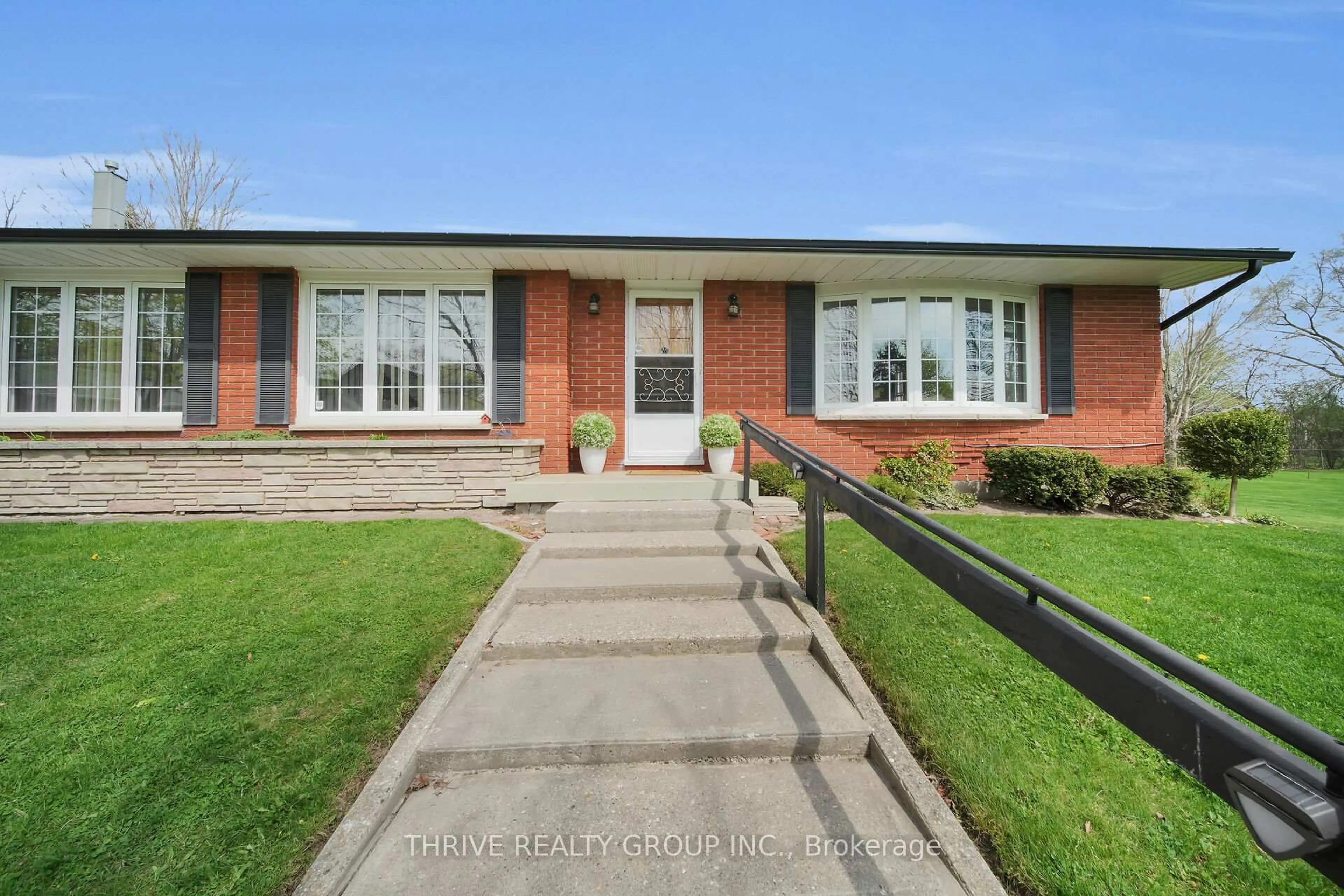Home with brick exterior material, street for 4036-4050 Elgin Rd, Thames Centre Ontario N0L 1V0