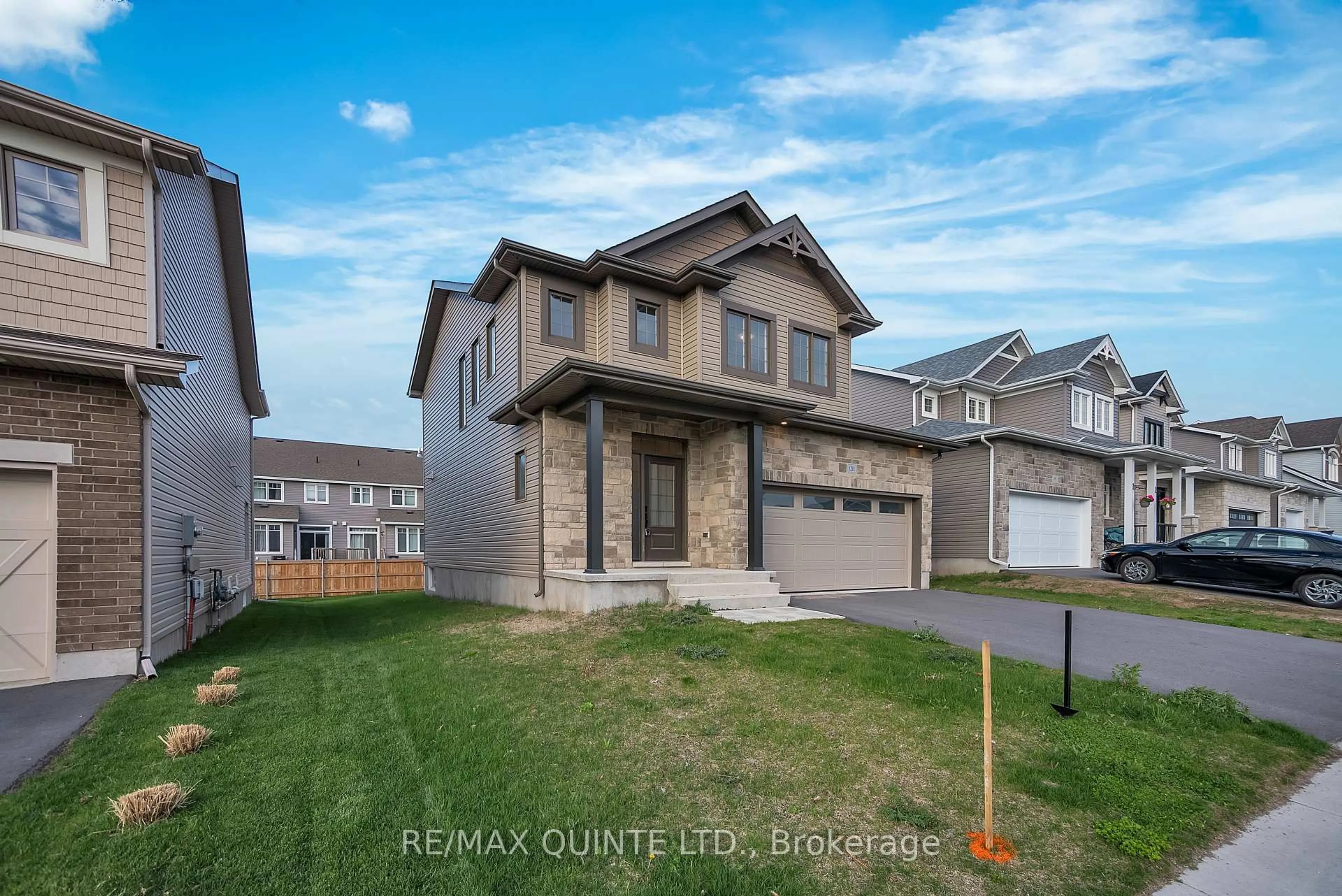 A pic from outside/outdoor area/front of a property/back of a property/a pic from drone, street for 1211 Waterside Way, Kingston Ontario K7K 0J1