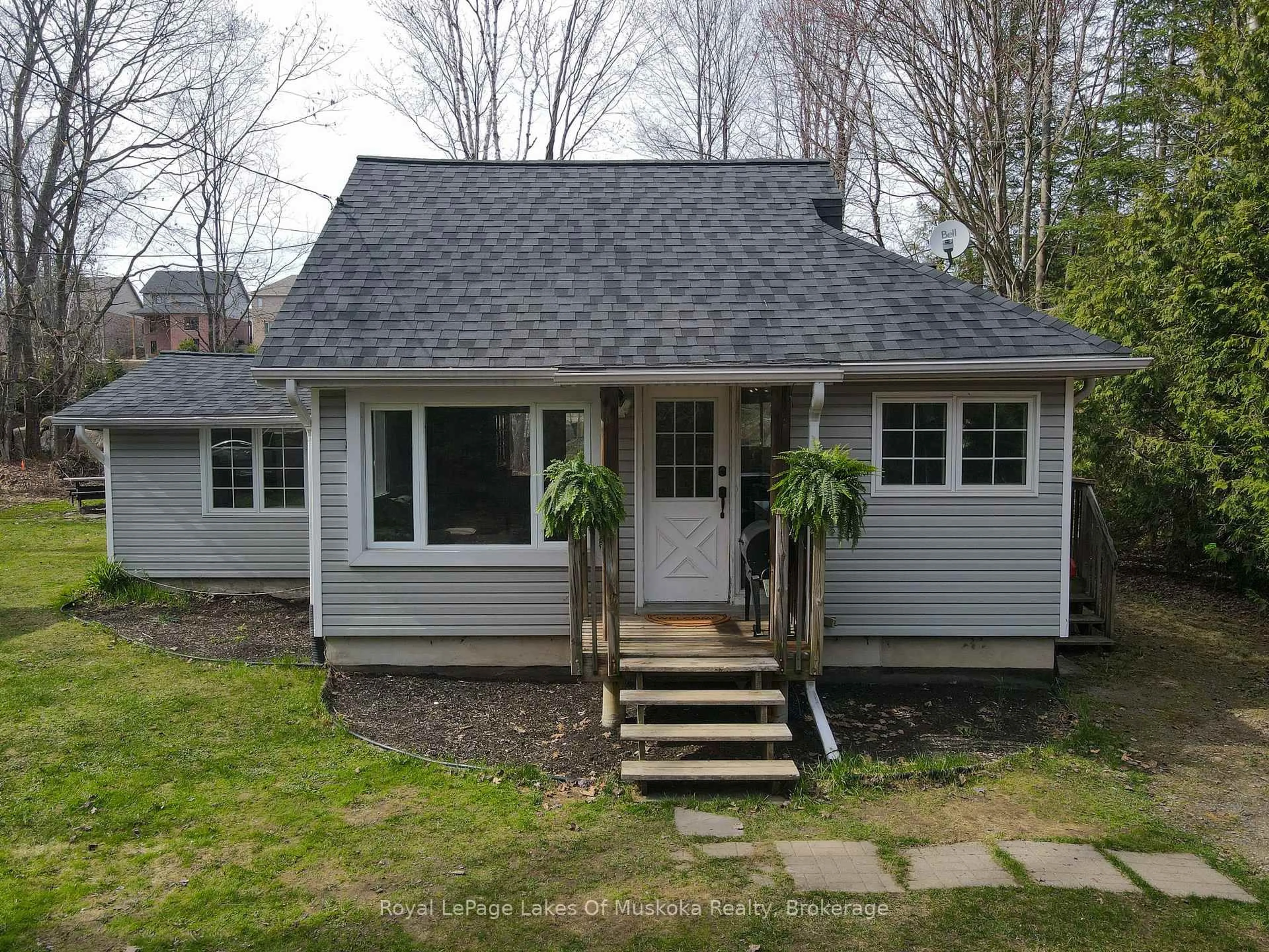 Home with vinyl exterior material, street for 6 Hibberd Lane, Huntsville Ontario P1H 1C9