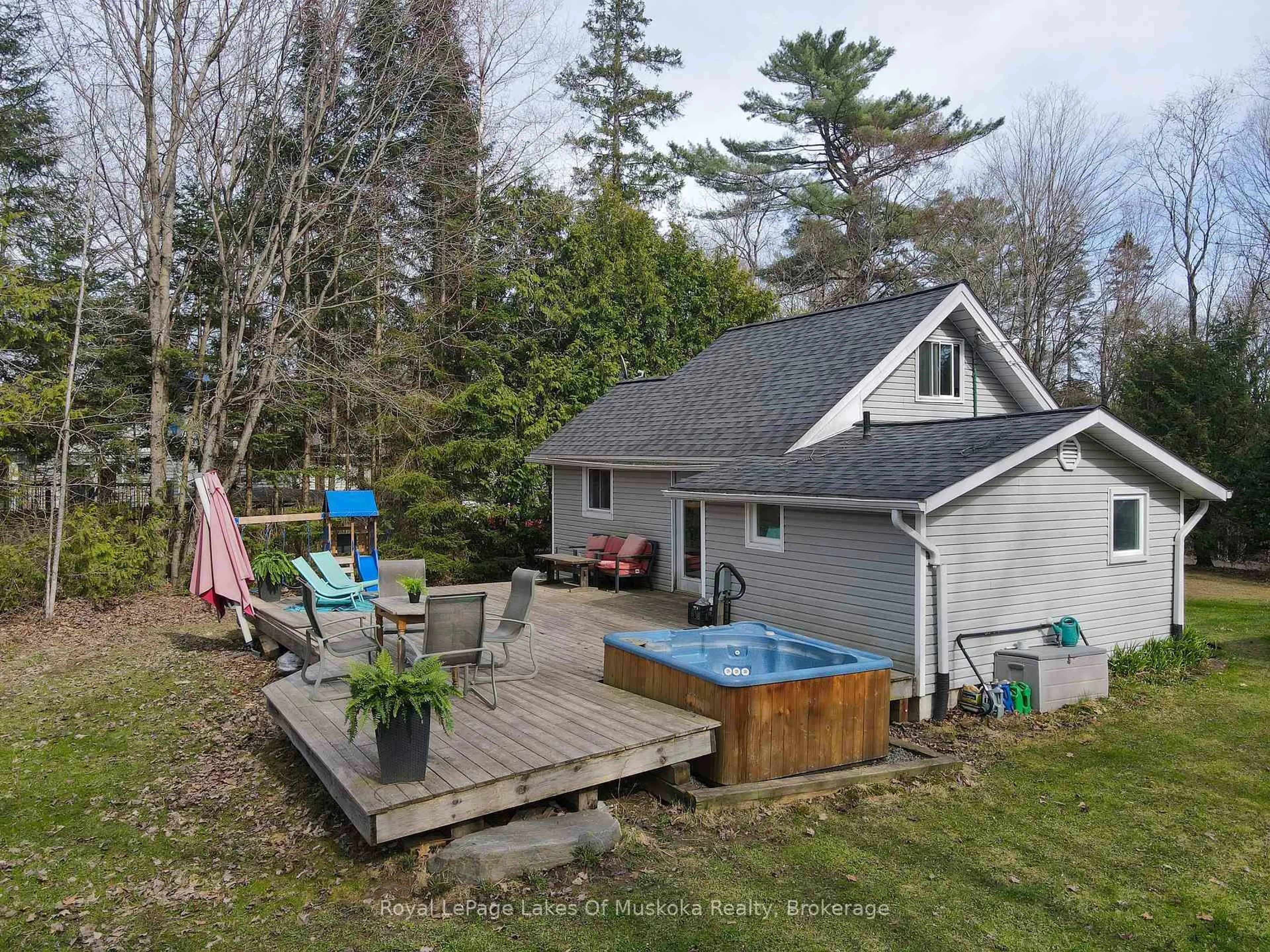 A pic from outside/outdoor area/front of a property/back of a property/a pic from drone, water/lake/river/ocean view for 6 Hibberd Lane, Huntsville Ontario P1H 1C9
