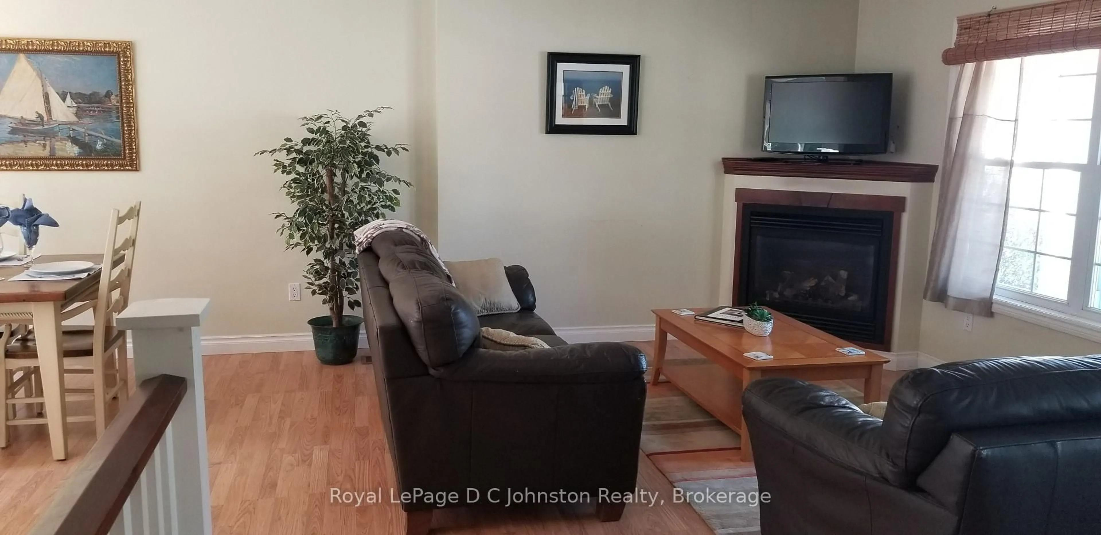 Living room with furniture, wood/laminate floor for 182 Emerald Dr, Saugeen Shores Ontario N0H 2L0