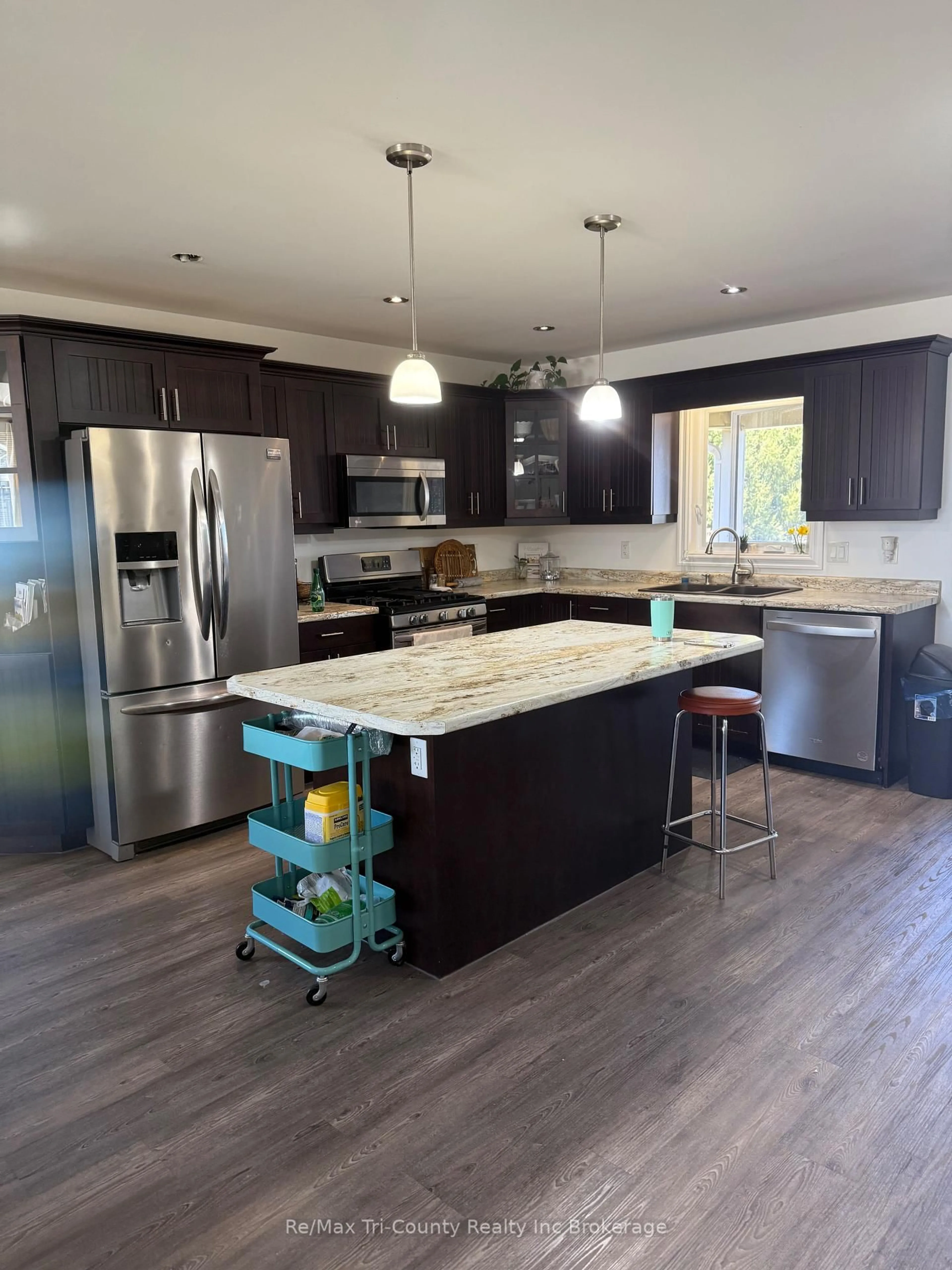 Open concept kitchen, wood/laminate floor for 56246 Donnelly Dr, Bayham Ontario N0J 1Y0