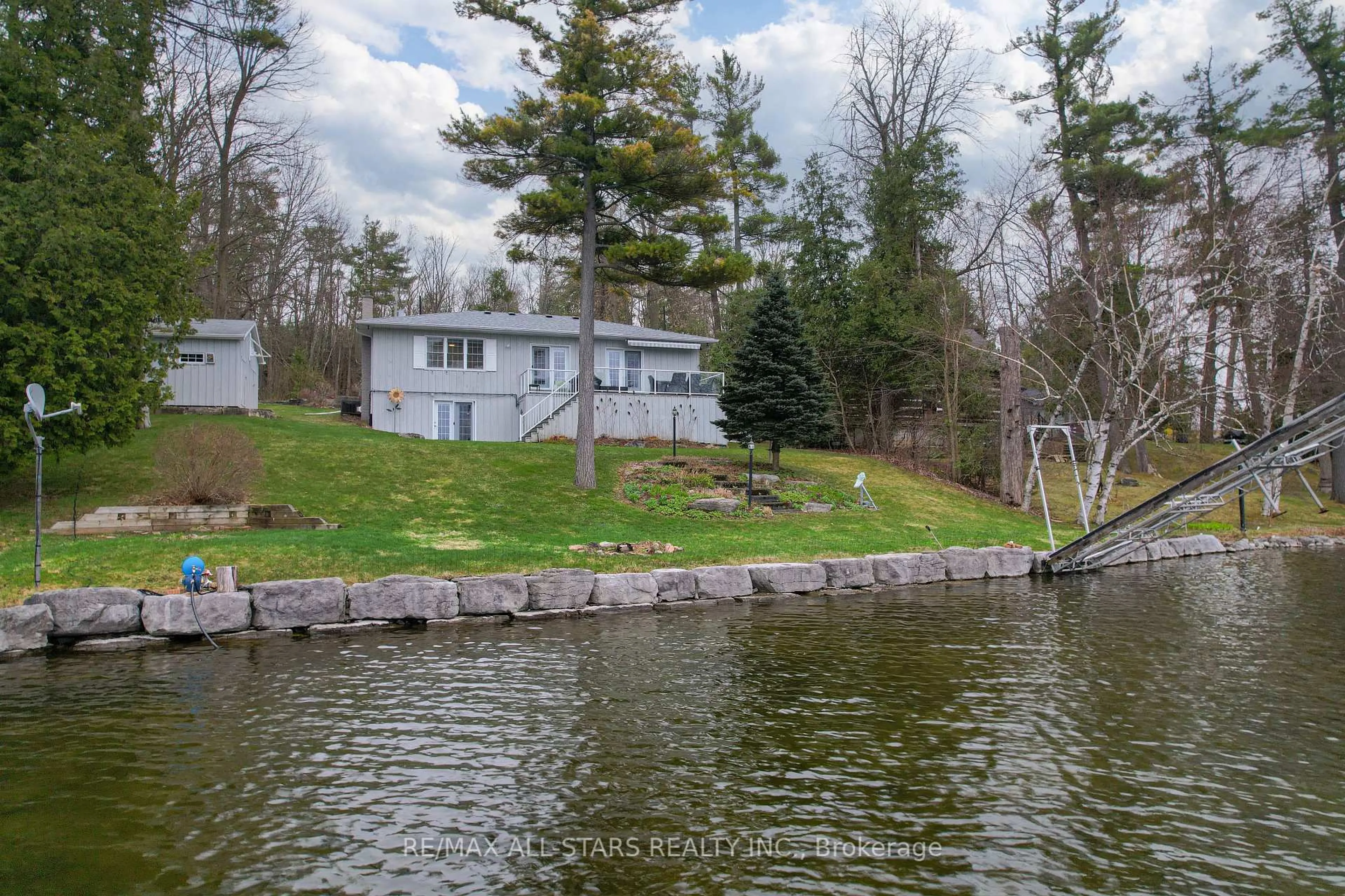 A pic from outside/outdoor area/front of a property/back of a property/a pic from drone, water/lake/river/ocean view for 308 Fife Ave, Smith-Ennismore-Lakefield Ontario K9J 0C6