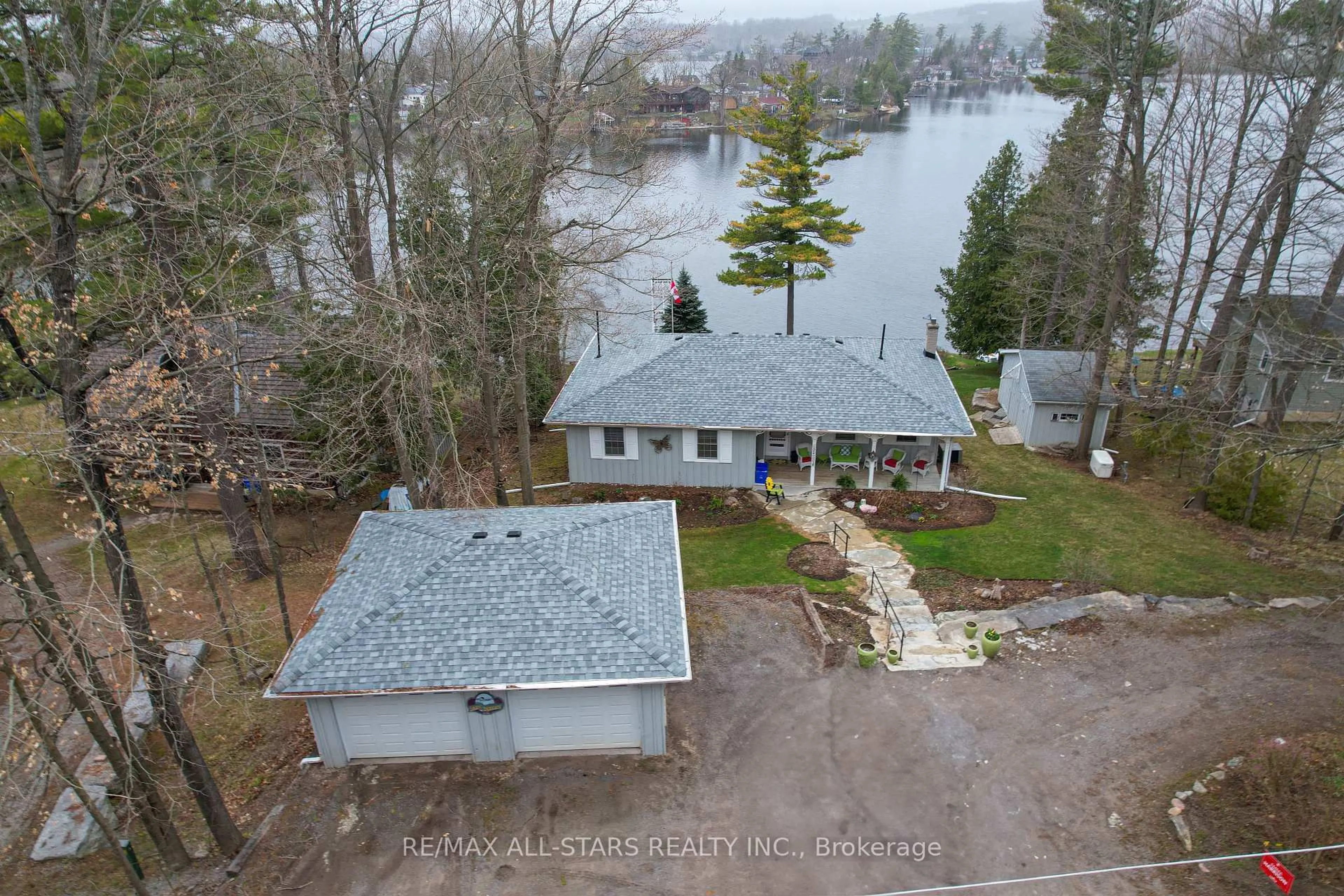 A pic from outside/outdoor area/front of a property/back of a property/a pic from drone, water/lake/river/ocean view for 308 Fife Ave, Smith-Ennismore-Lakefield Ontario K9J 0C6