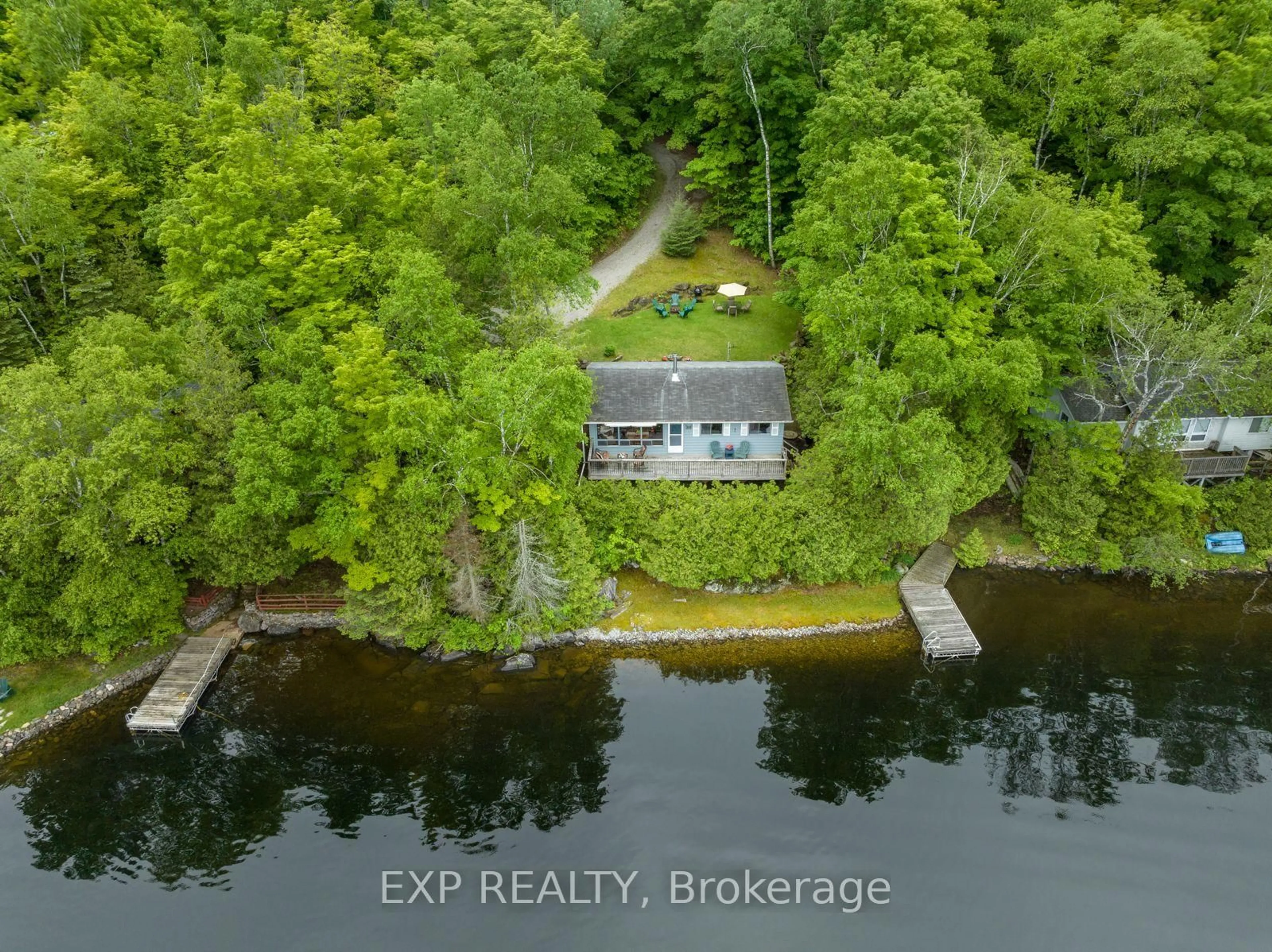 A pic from outside/outdoor area/front of a property/back of a property/a pic from drone, water/lake/river/ocean view for 400B Gilbert Bay Lane, Coe Hill Ontario K0L 1P0