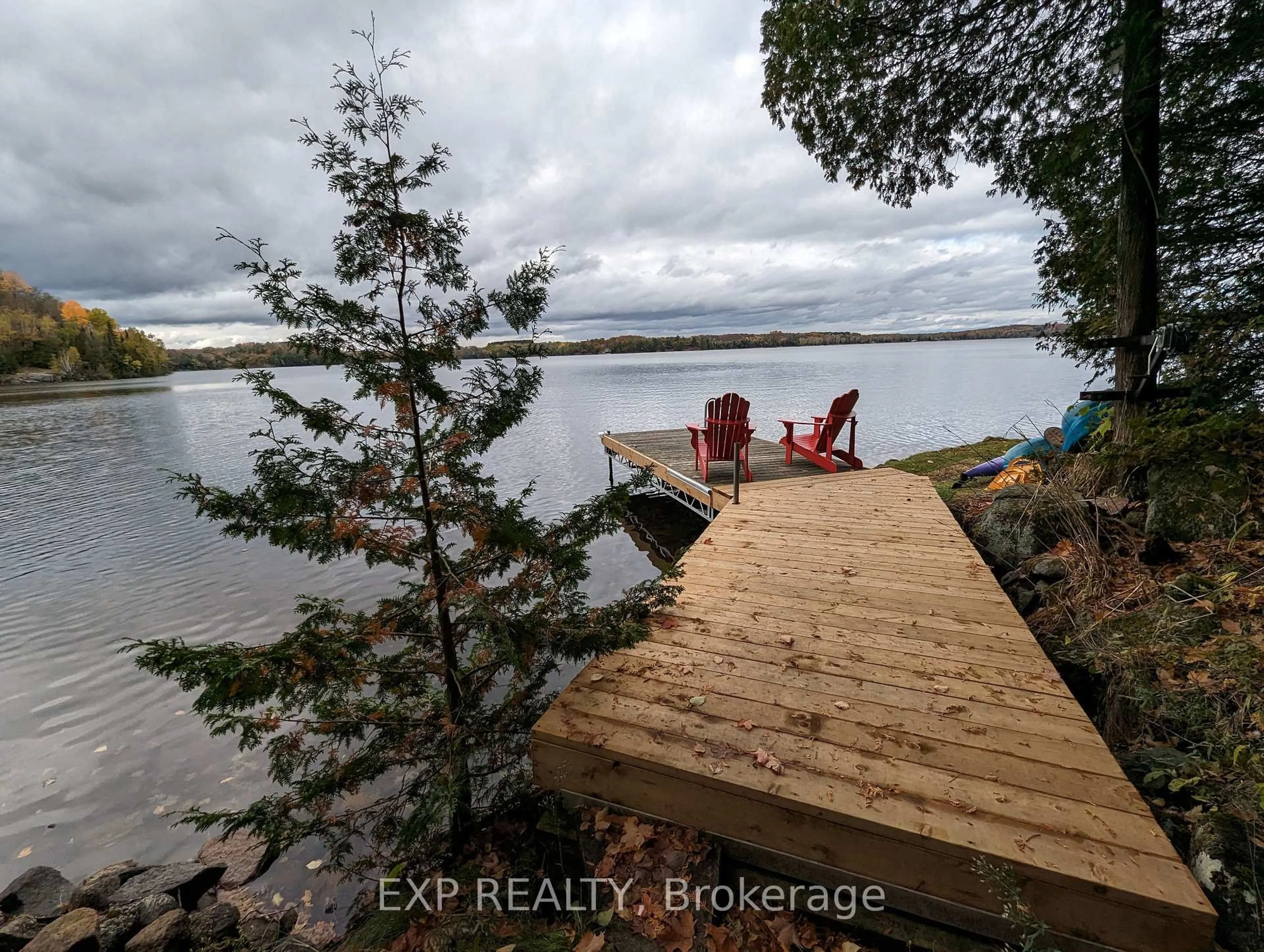 A pic from outside/outdoor area/front of a property/back of a property/a pic from drone, water/lake/river/ocean view for 400B Gilbert Bay Lane, Coe Hill Ontario K0L 1P0
