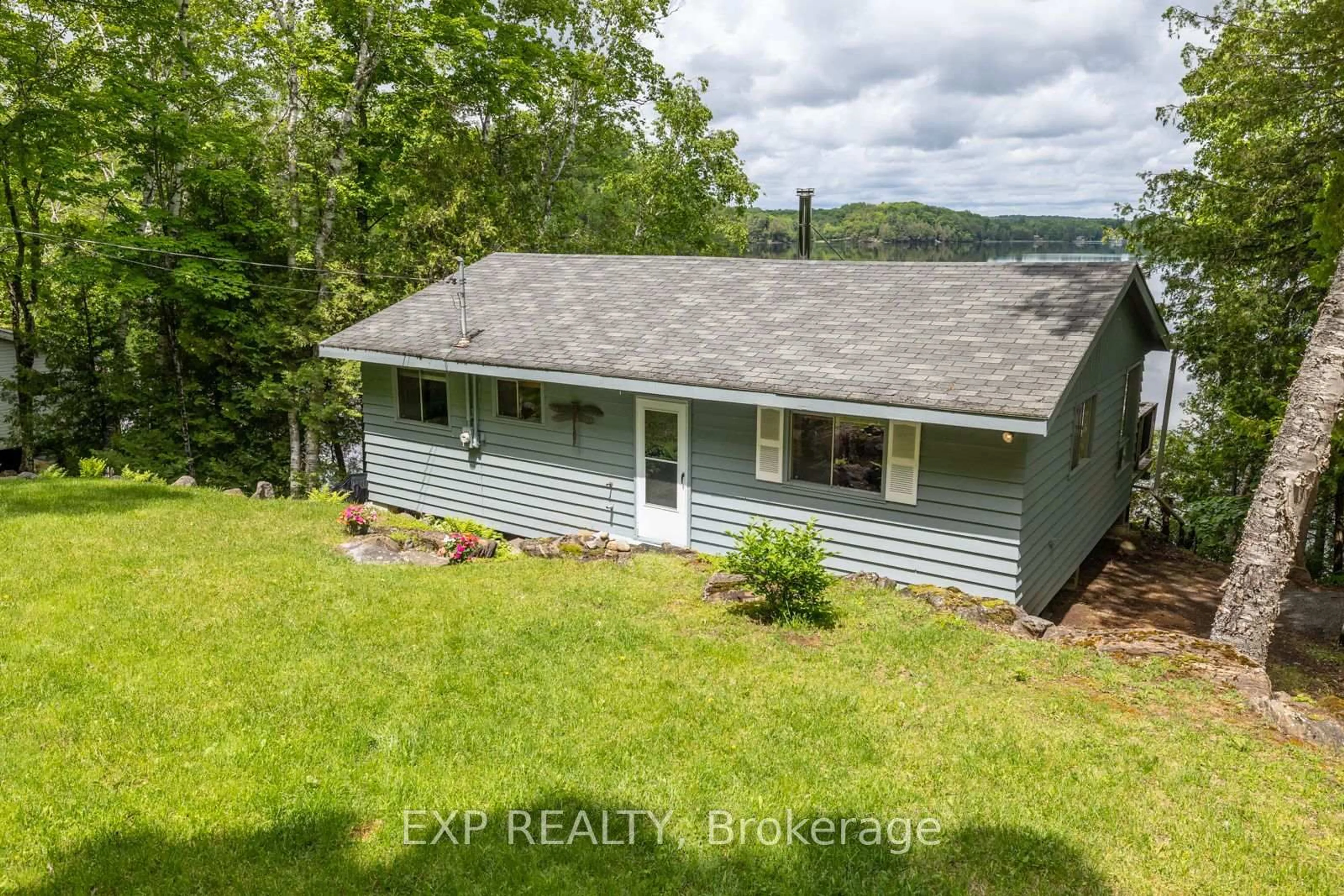 A pic from outside/outdoor area/front of a property/back of a property/a pic from drone, water/lake/river/ocean view for 400B Gilbert Bay Lane, Coe Hill Ontario K0L 1P0