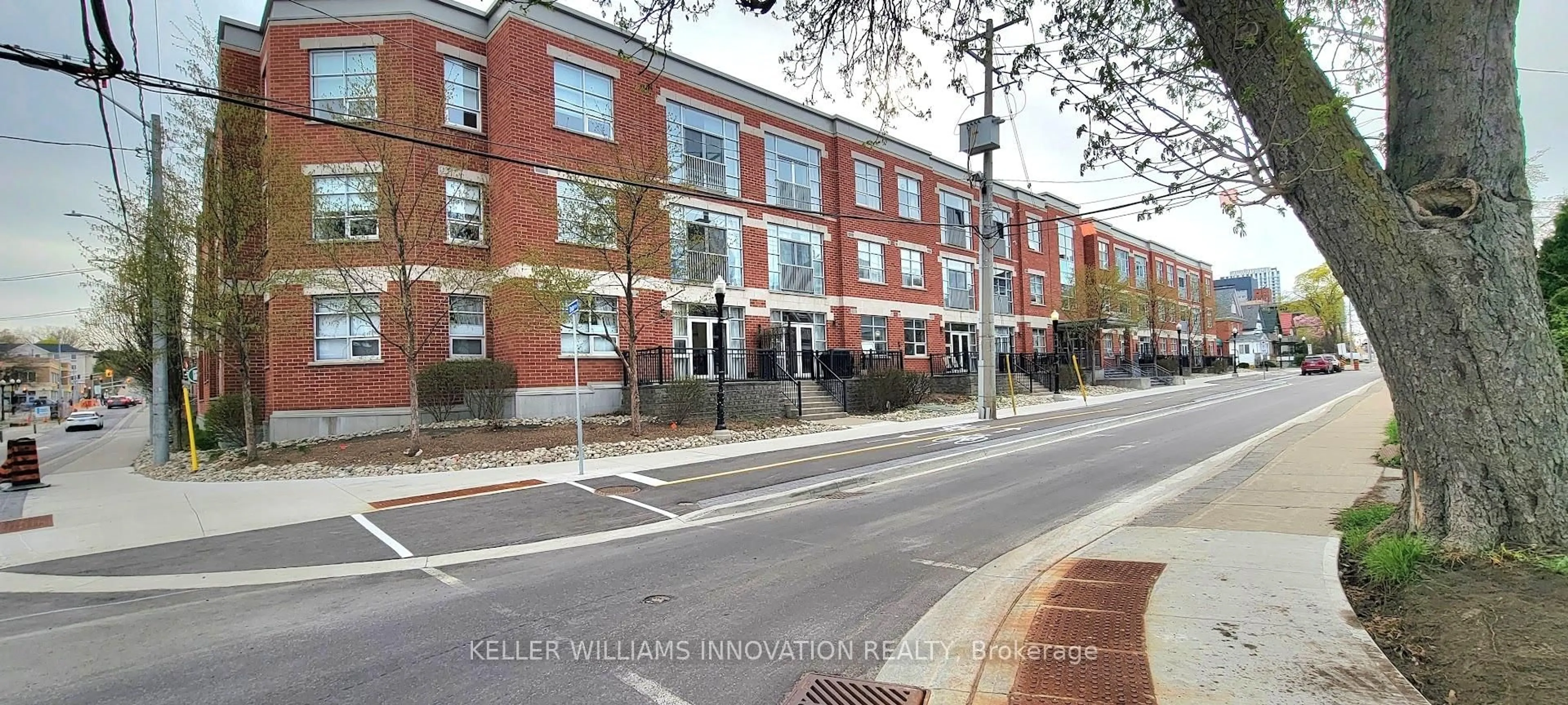 Home with brick exterior material, street for 165 Duke St #210, Kitchener Ontario N2H 6T8