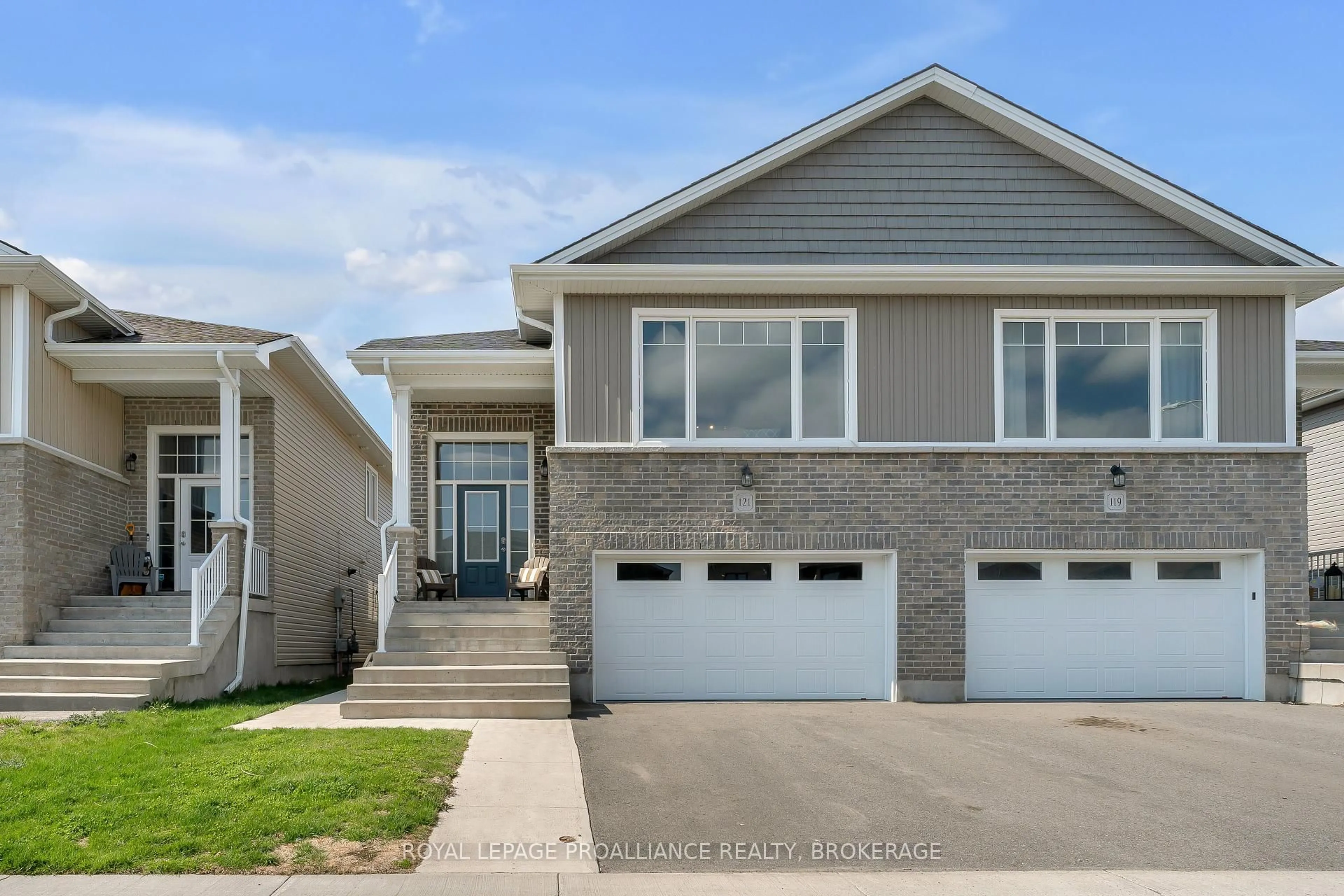 Home with vinyl exterior material, street for 121 Dr Richard James Cres, Loyalist Ontario K7N 0B9