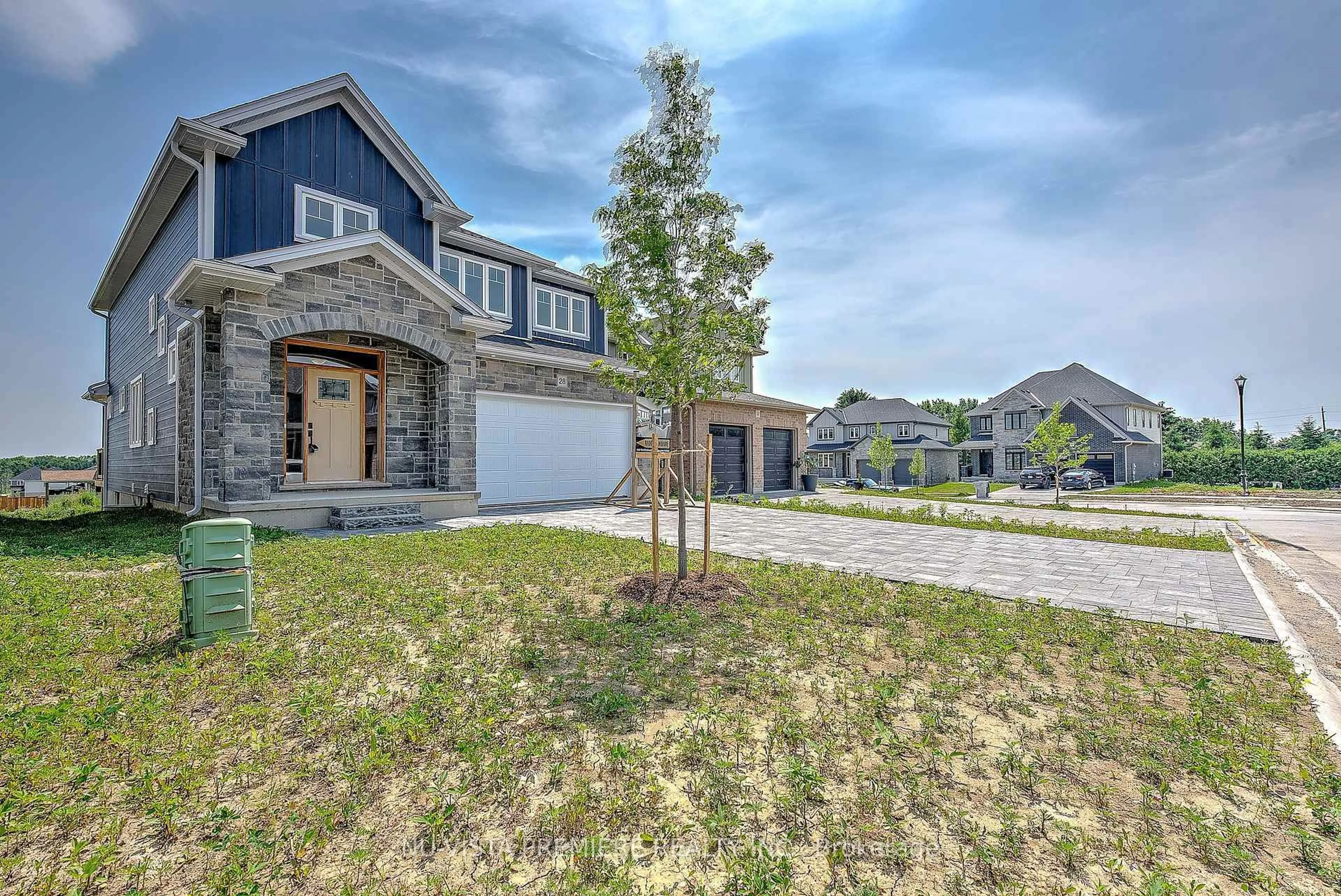 A pic from outside/outdoor area/front of a property/back of a property/a pic from drone, street for 28 Basil Cres, Middlesex Centre Ontario N0M 2A0