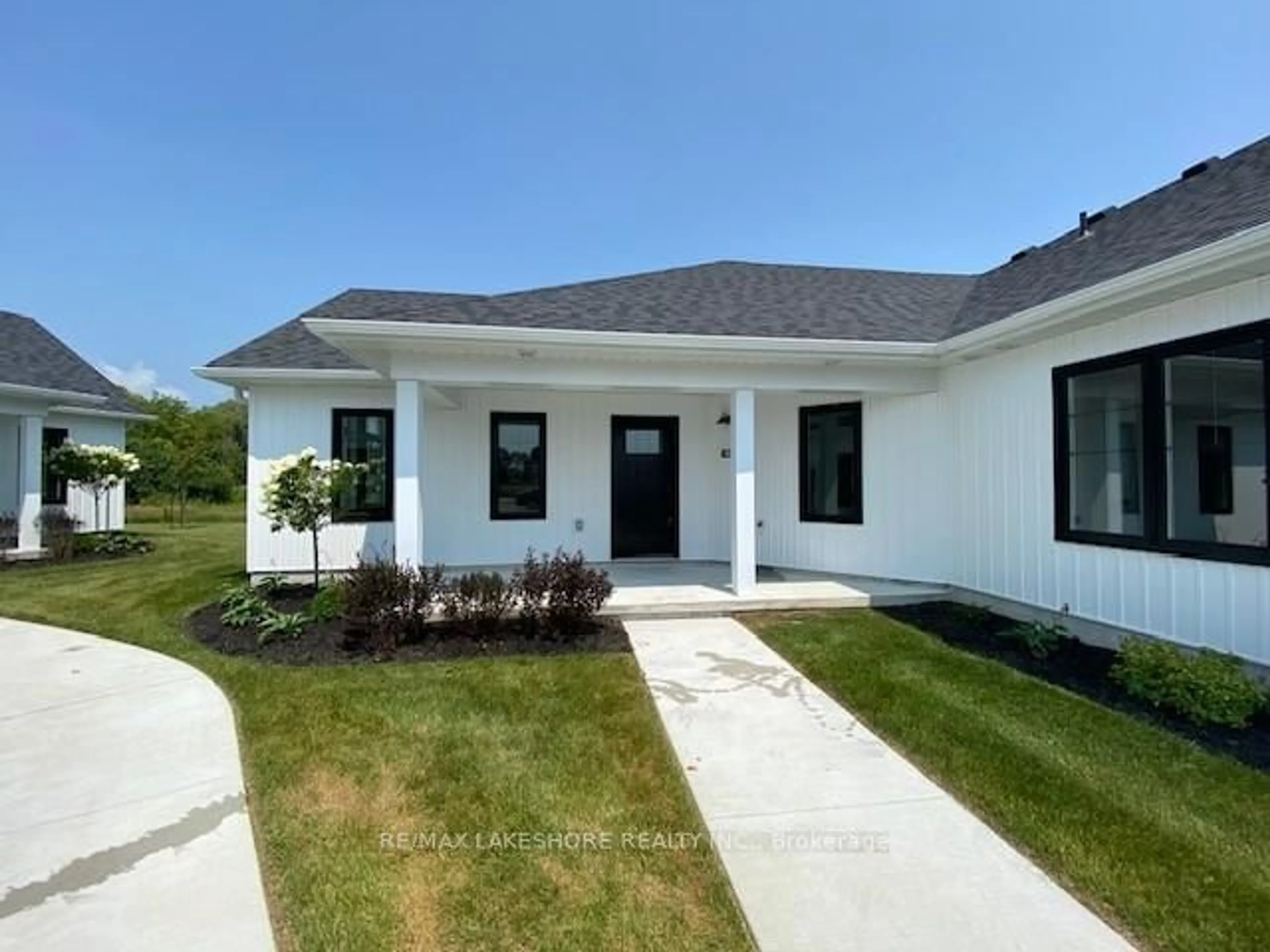 Home with vinyl exterior material, street for 14 MEADOWCREEK Dr #103, Brighton Ontario K0K 1H0