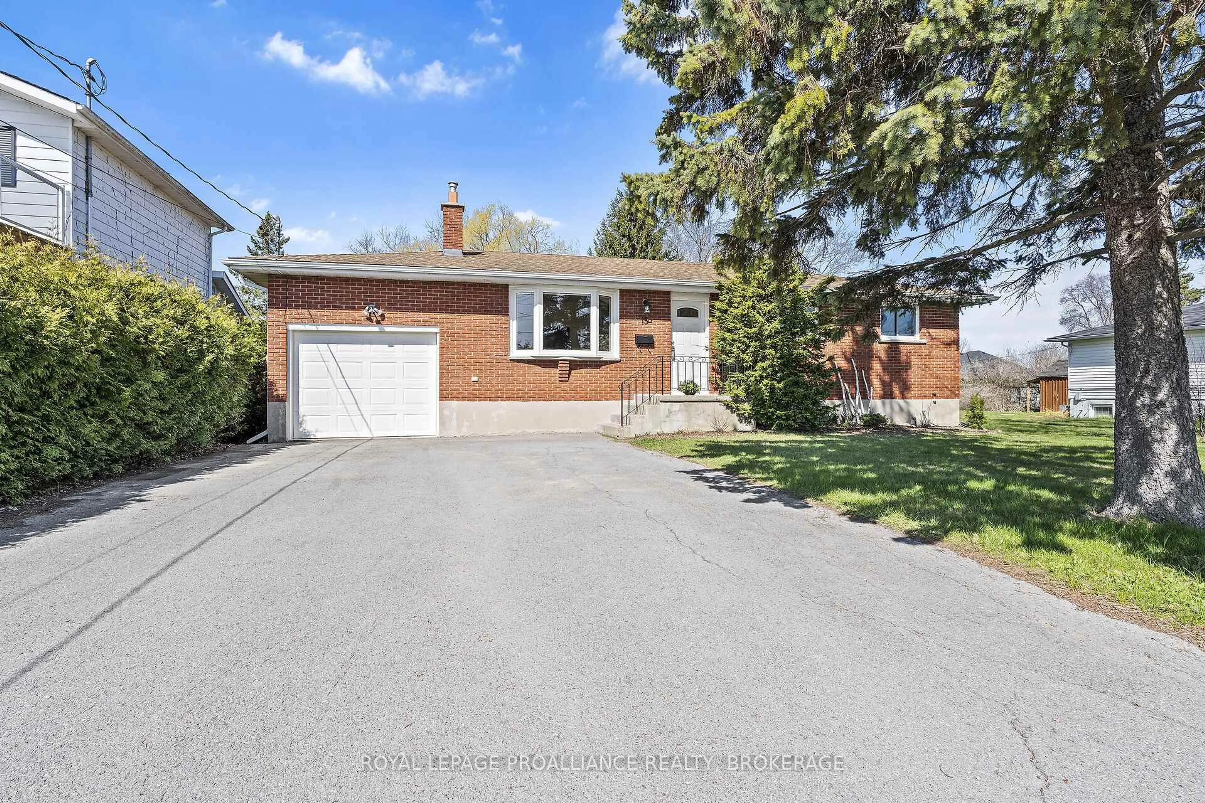 Home with brick exterior material, street for 15 Sunny Acres Rd, Kingston Ontario K7M 3N3