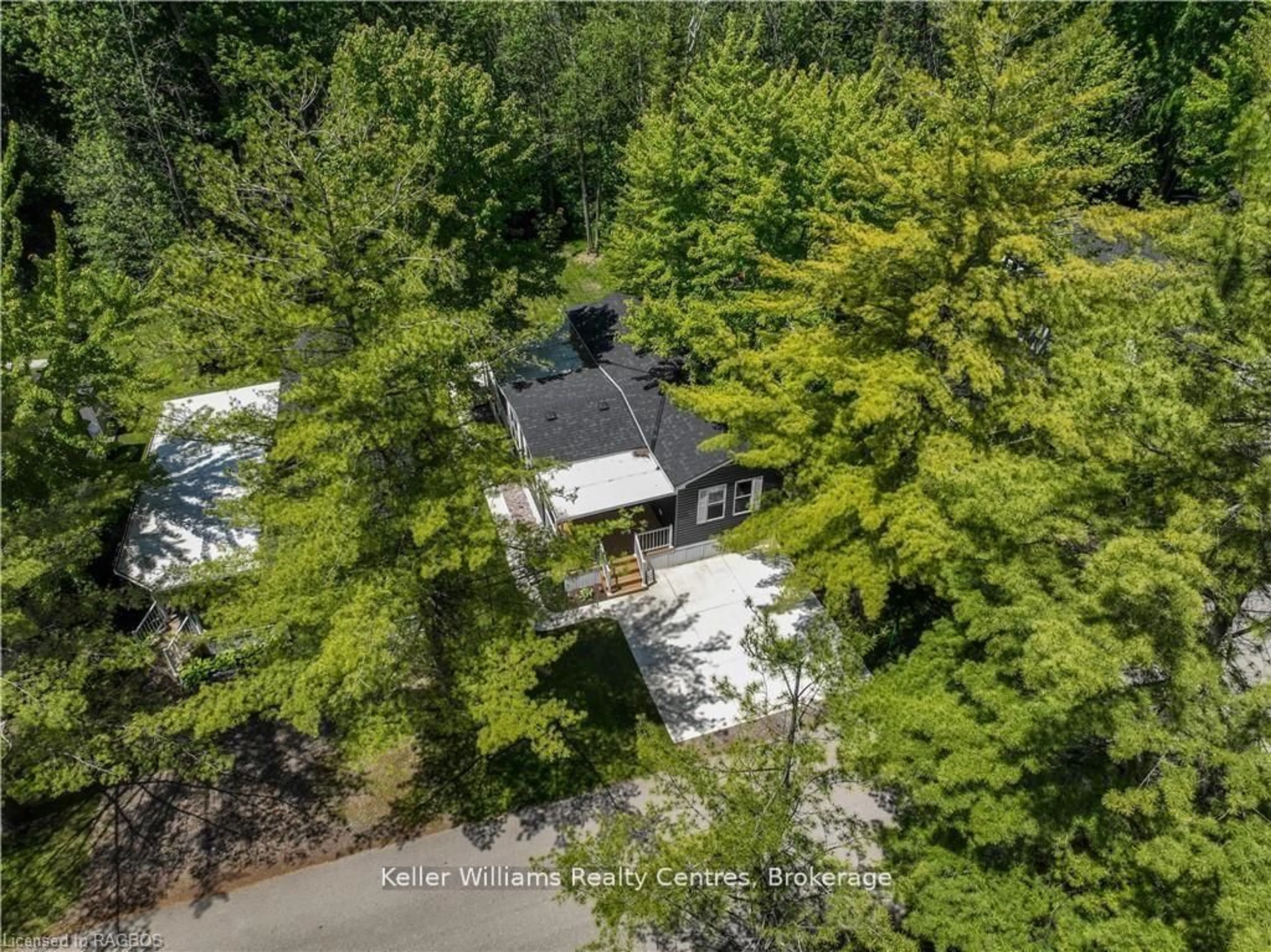A pic from outside/outdoor area/front of a property/back of a property/a pic from drone, forest/trees view for 13 Southline #157 Ave, Huron-Kinloss Ontario N2Z 2X5