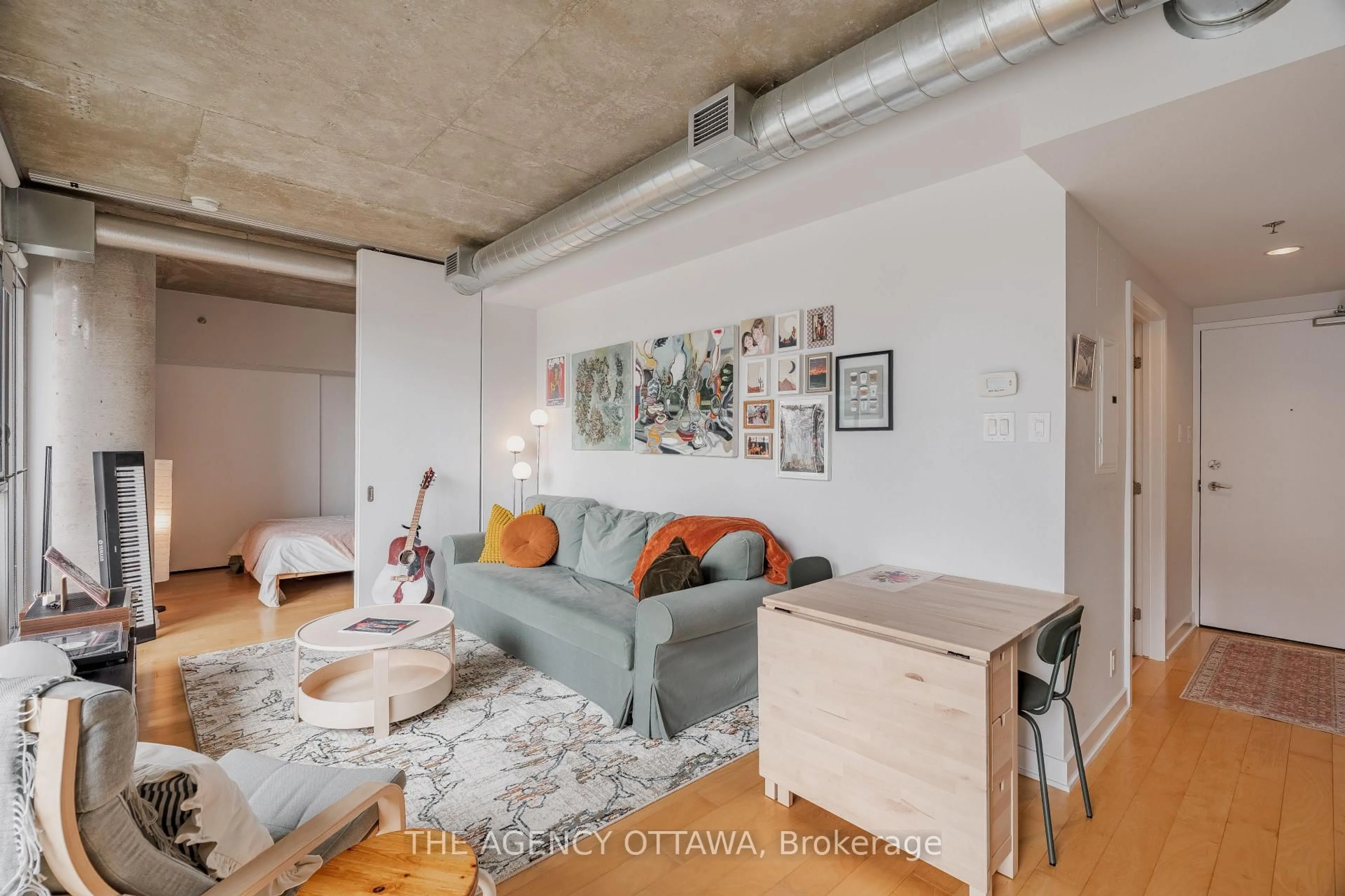 Living room with furniture, cement floor for 340 Mcleod St #550, Ottawa Ontario K2P 1A4