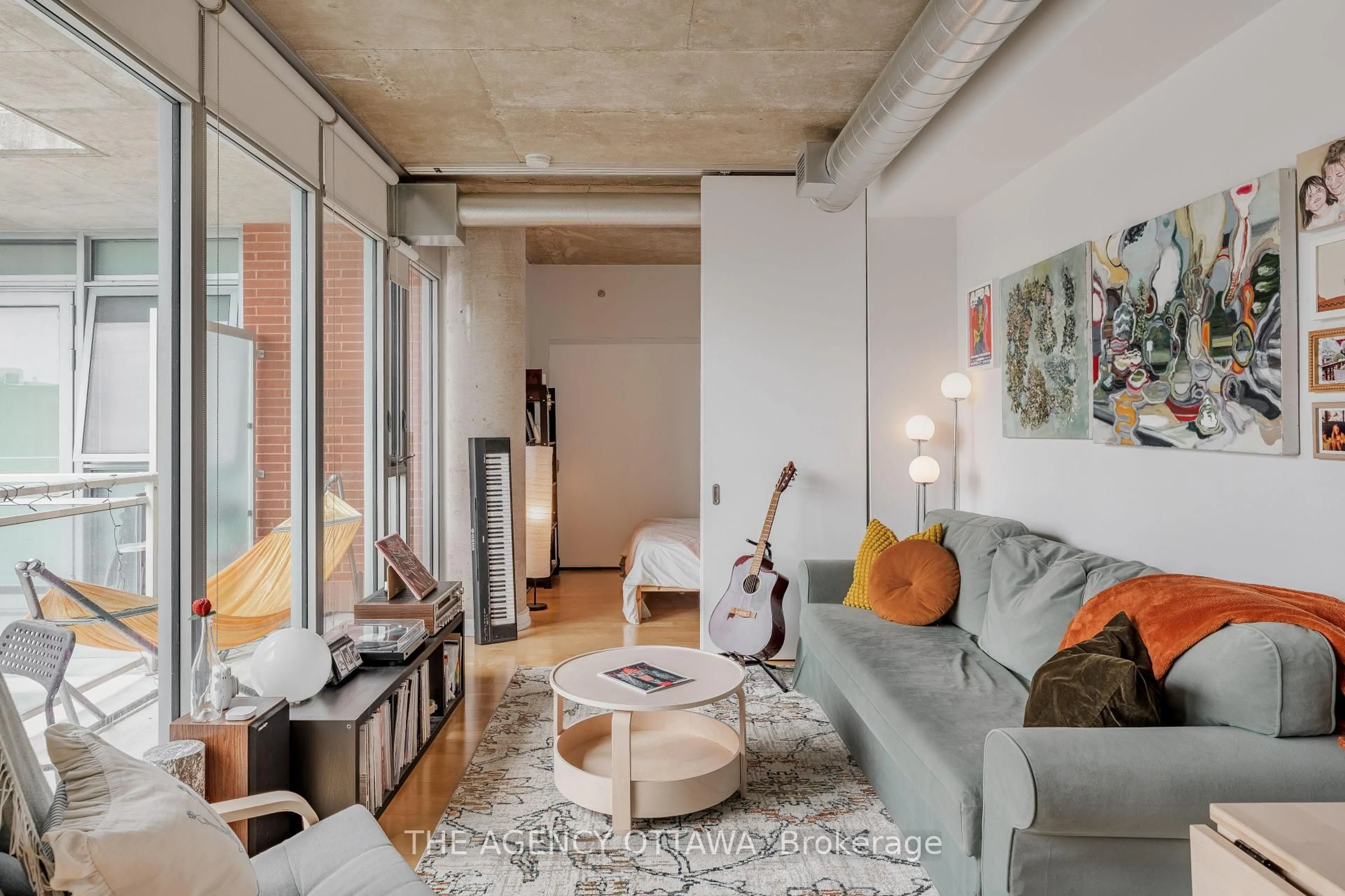 Living room with furniture, cement floor for 340 Mcleod St #550, Ottawa Ontario K2P 1A4