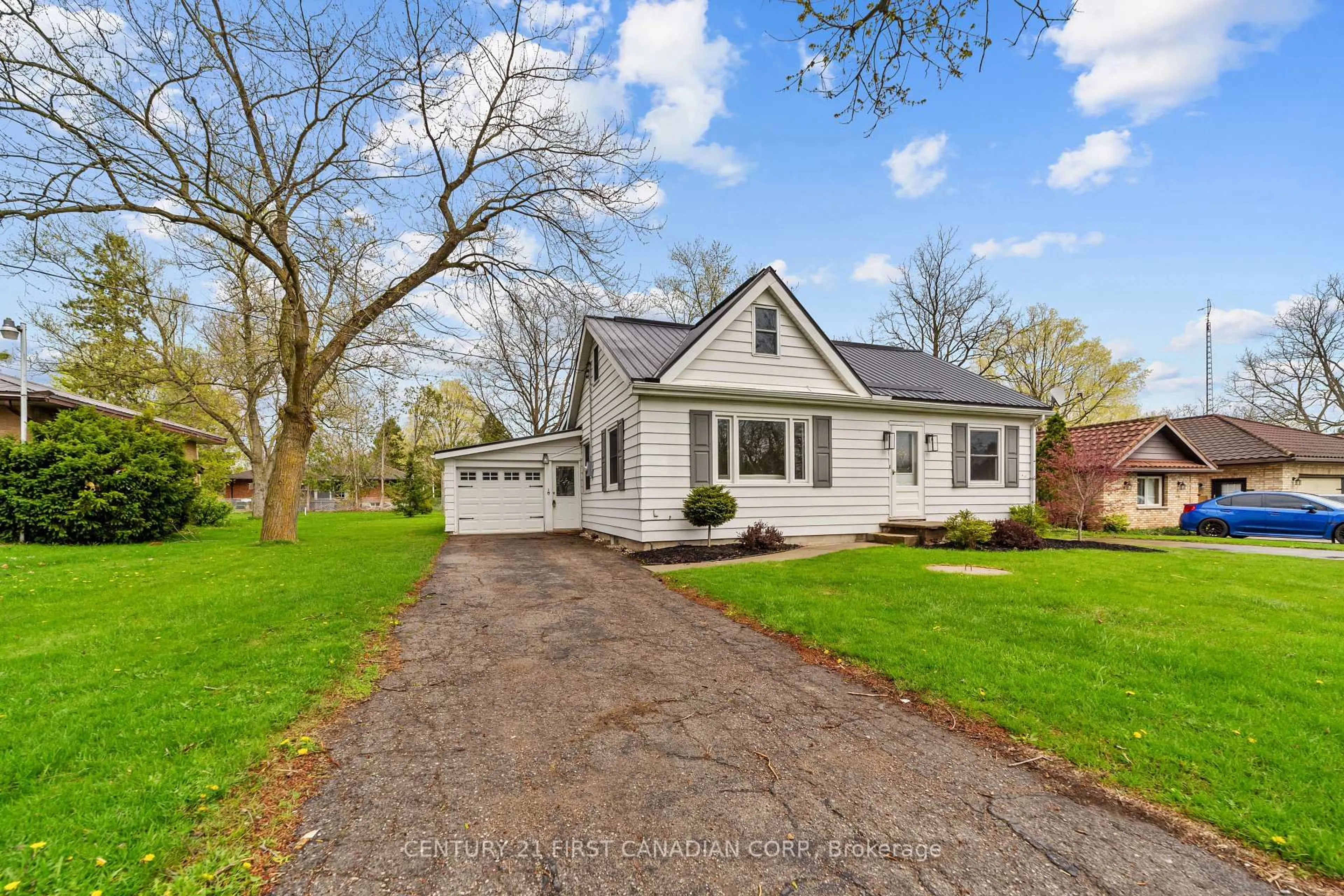 Home with vinyl exterior material, street for 24342 Poplar Hill Rd, Middlesex Centre Ontario N0M 2A0