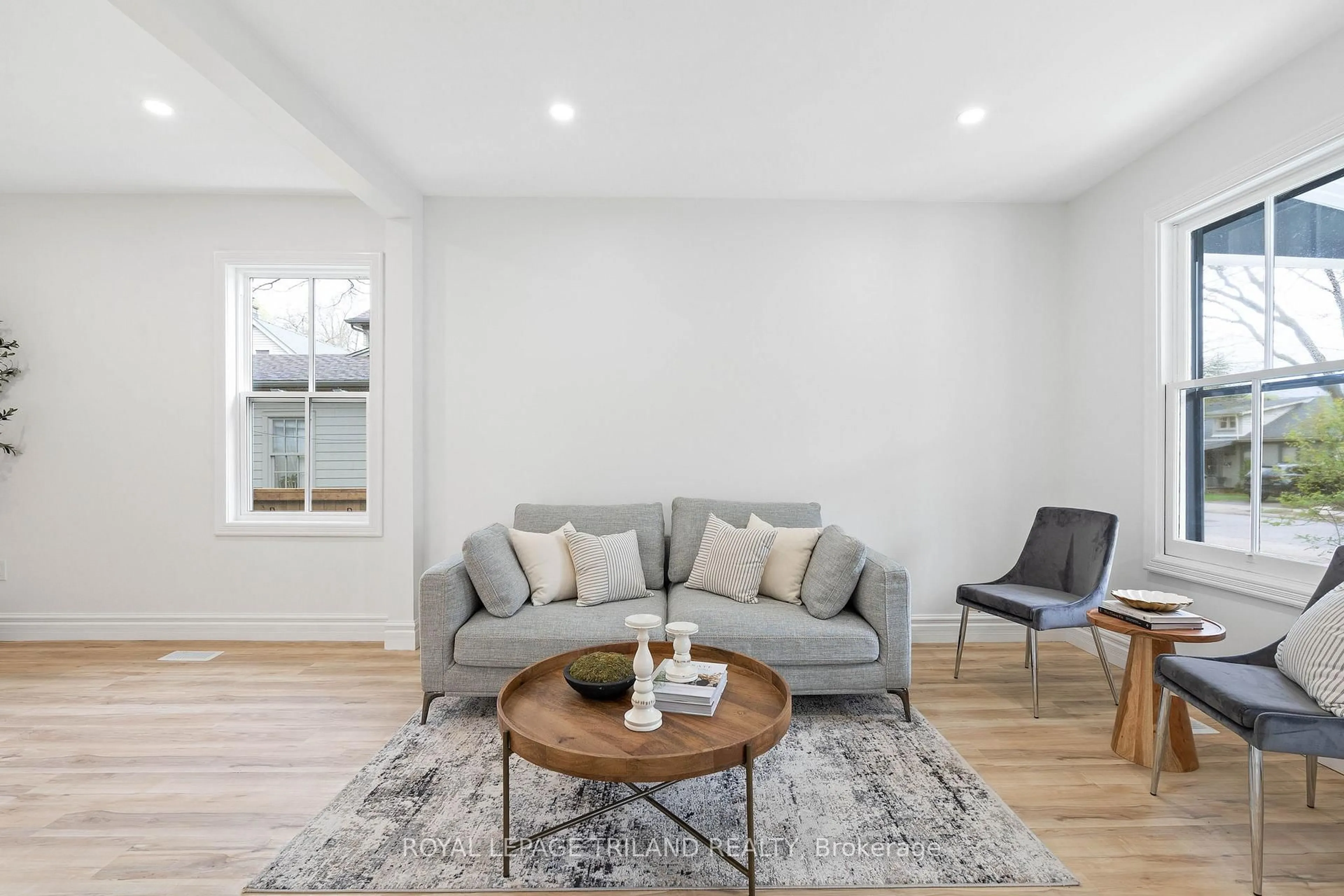 Living room with furniture, wood/laminate floor for 57 Palace St, London East Ontario N6B 3A6