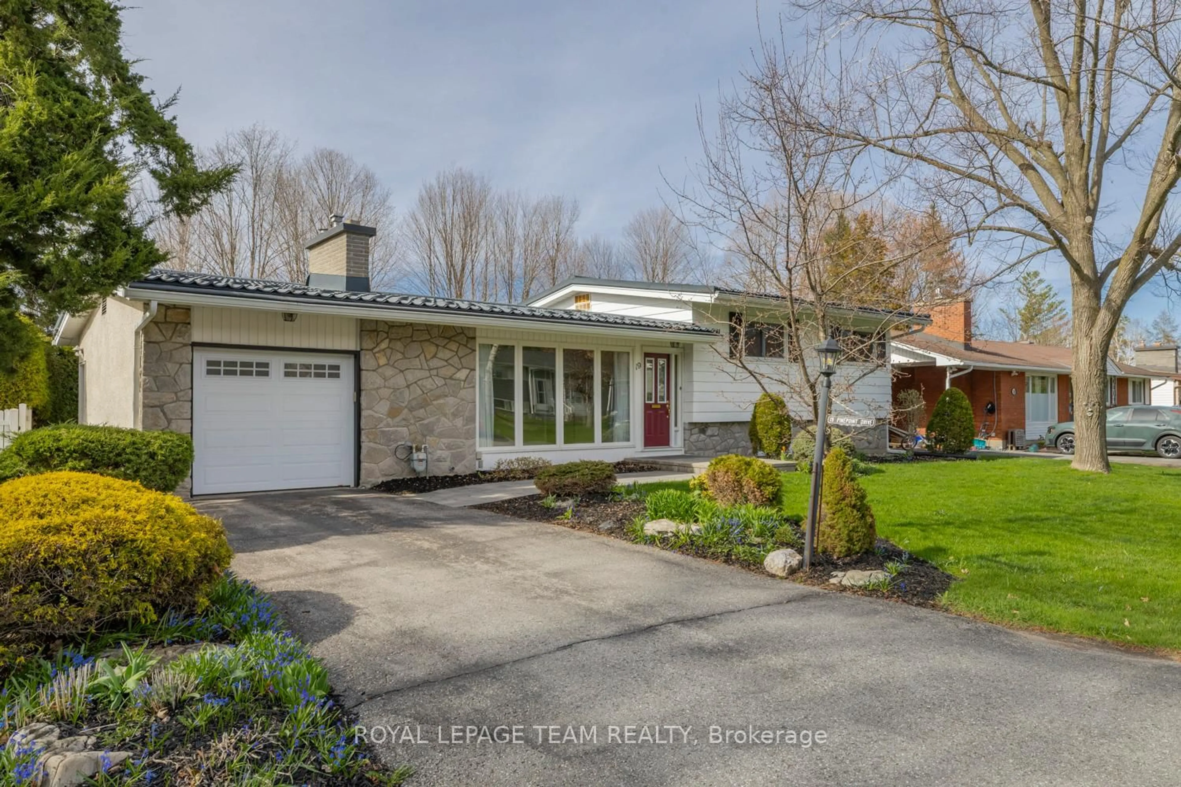 Home with brick exterior material, street for 19 Pinepoint Dr, Ottawa Ontario K2H 6B1