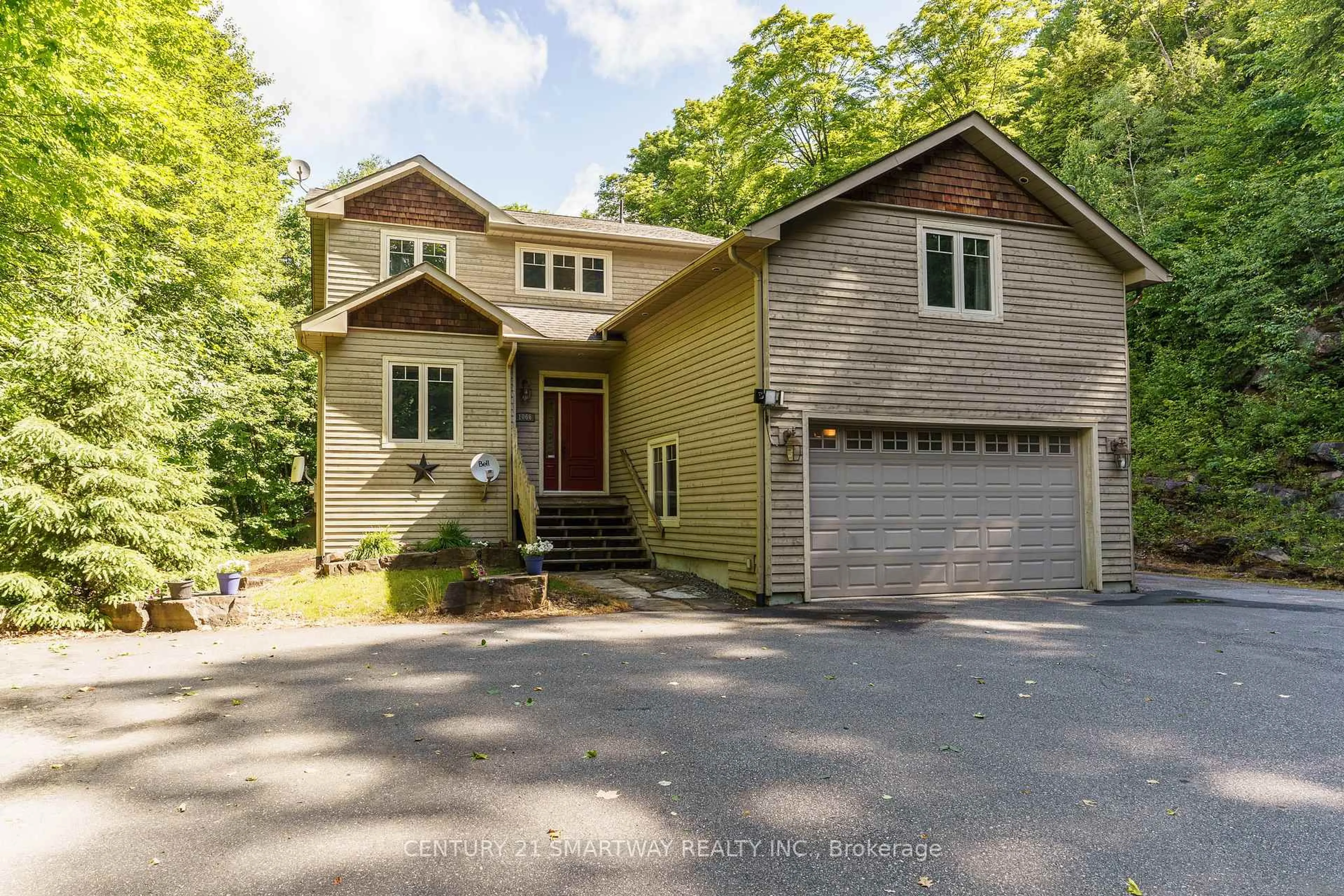 Home with brick exterior material, street for 1066 Tally-Ho Winter Park Rd, Lake of Bays Ontario P1H 2J6