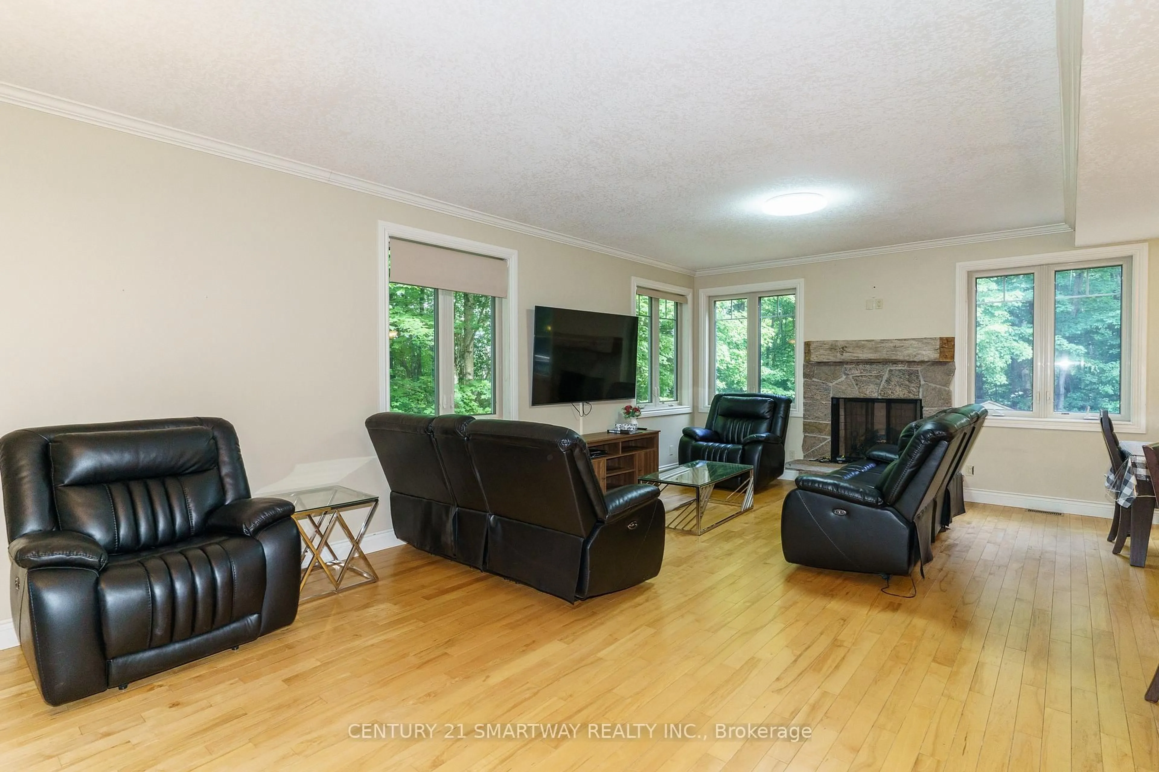 Living room with furniture, wood/laminate floor for 1066 Tally-Ho Winter Park Rd, Lake of Bays Ontario P1H 2J6