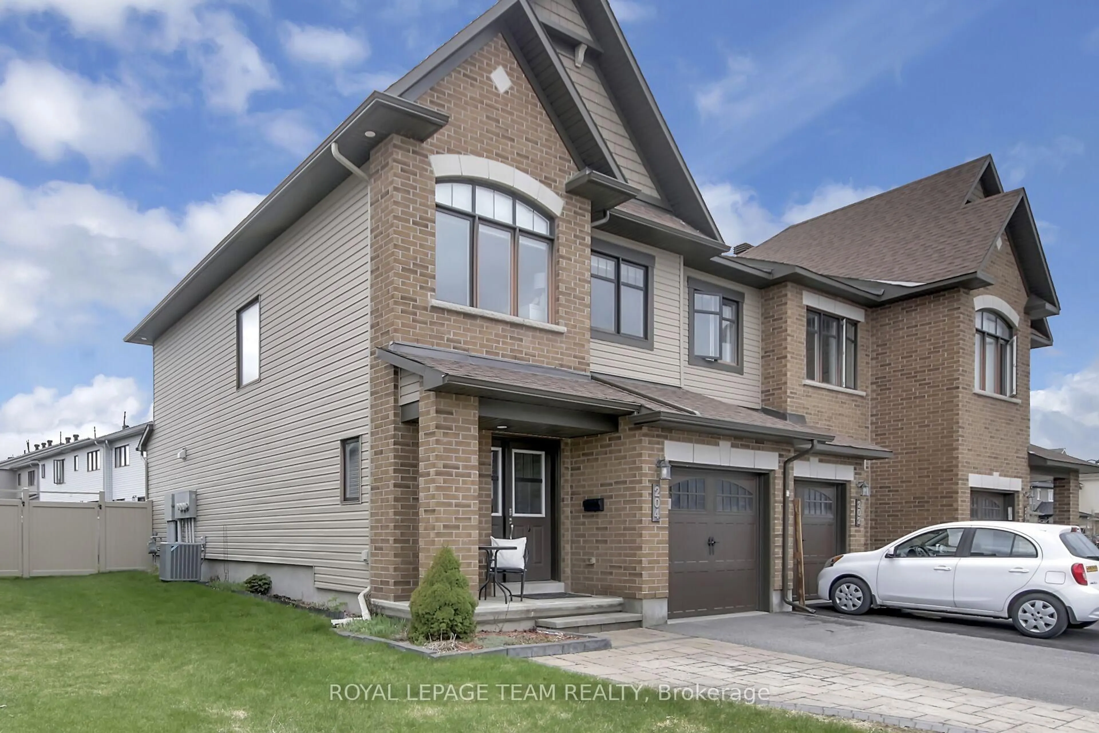 Home with brick exterior material, street for 204 Clonrush Way, Ottawa Ontario K2T 0K7