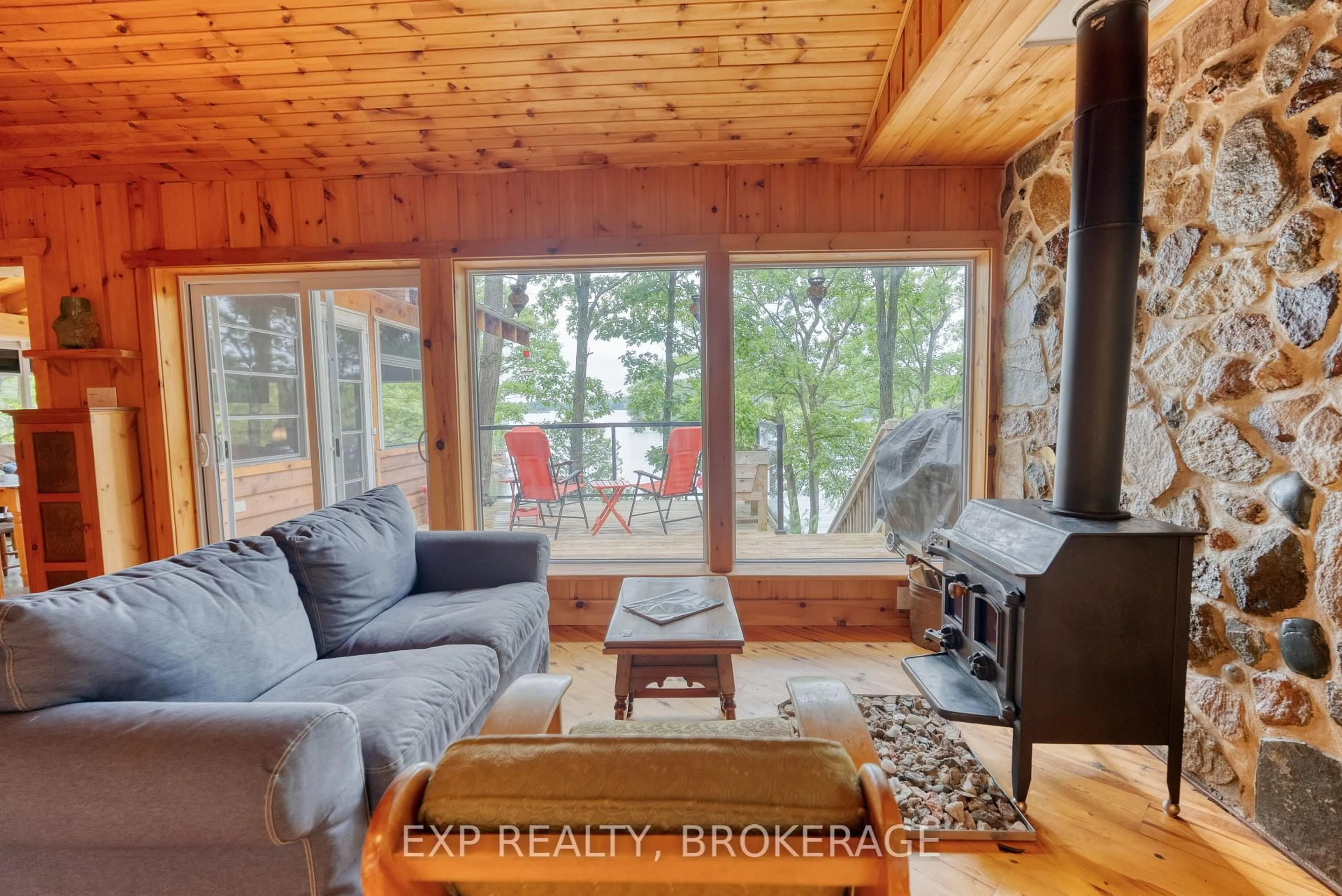 Living room with furniture, wood/laminate floor for 133 Badour Island N/A, Sharbot Lake Ontario K0H 2P0