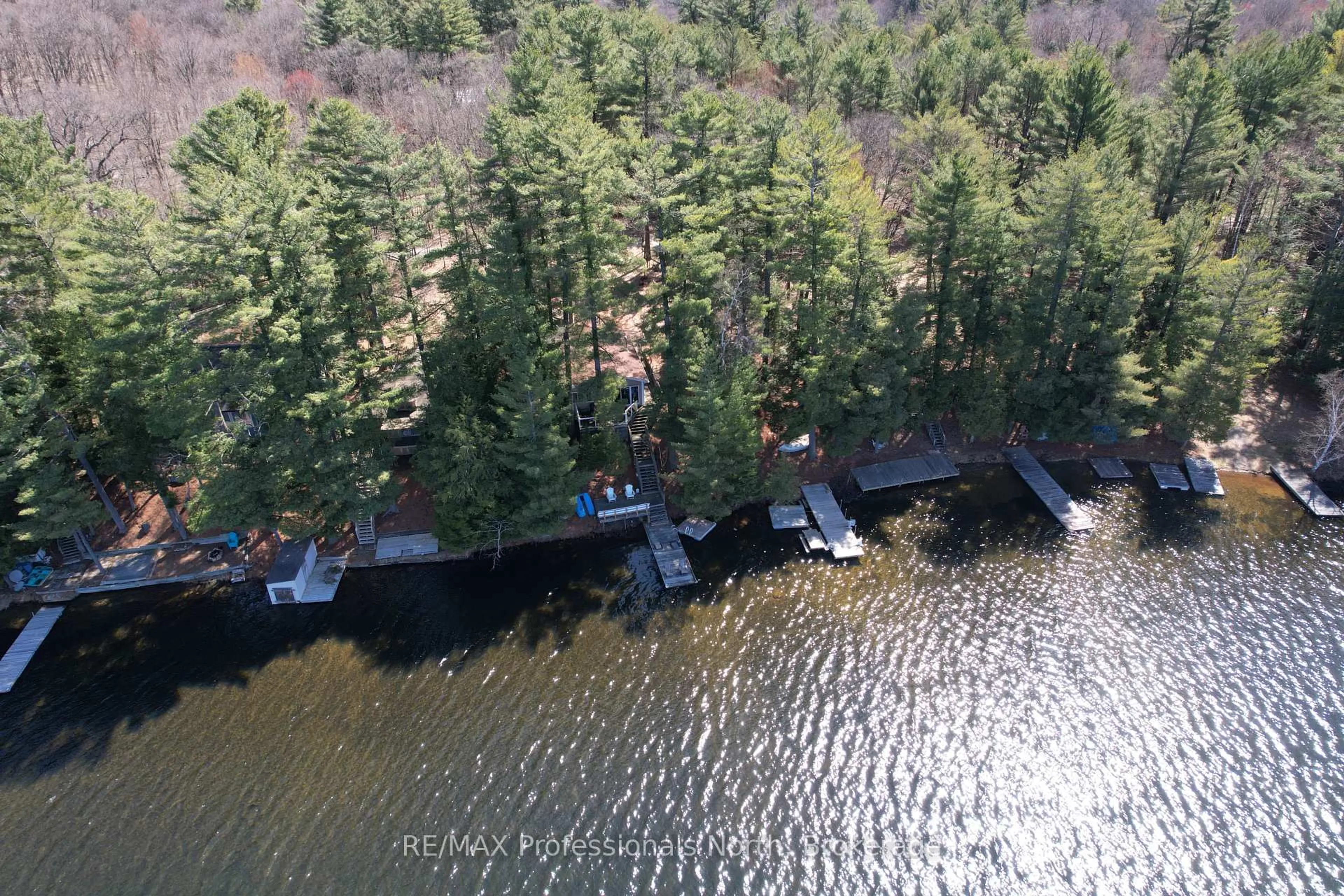 A pic from outside/outdoor area/front of a property/back of a property/a pic from drone, water/lake/river/ocean view for 1158-8 Clearwater Lake Rd, Huntsville Ontario P0B 1L0