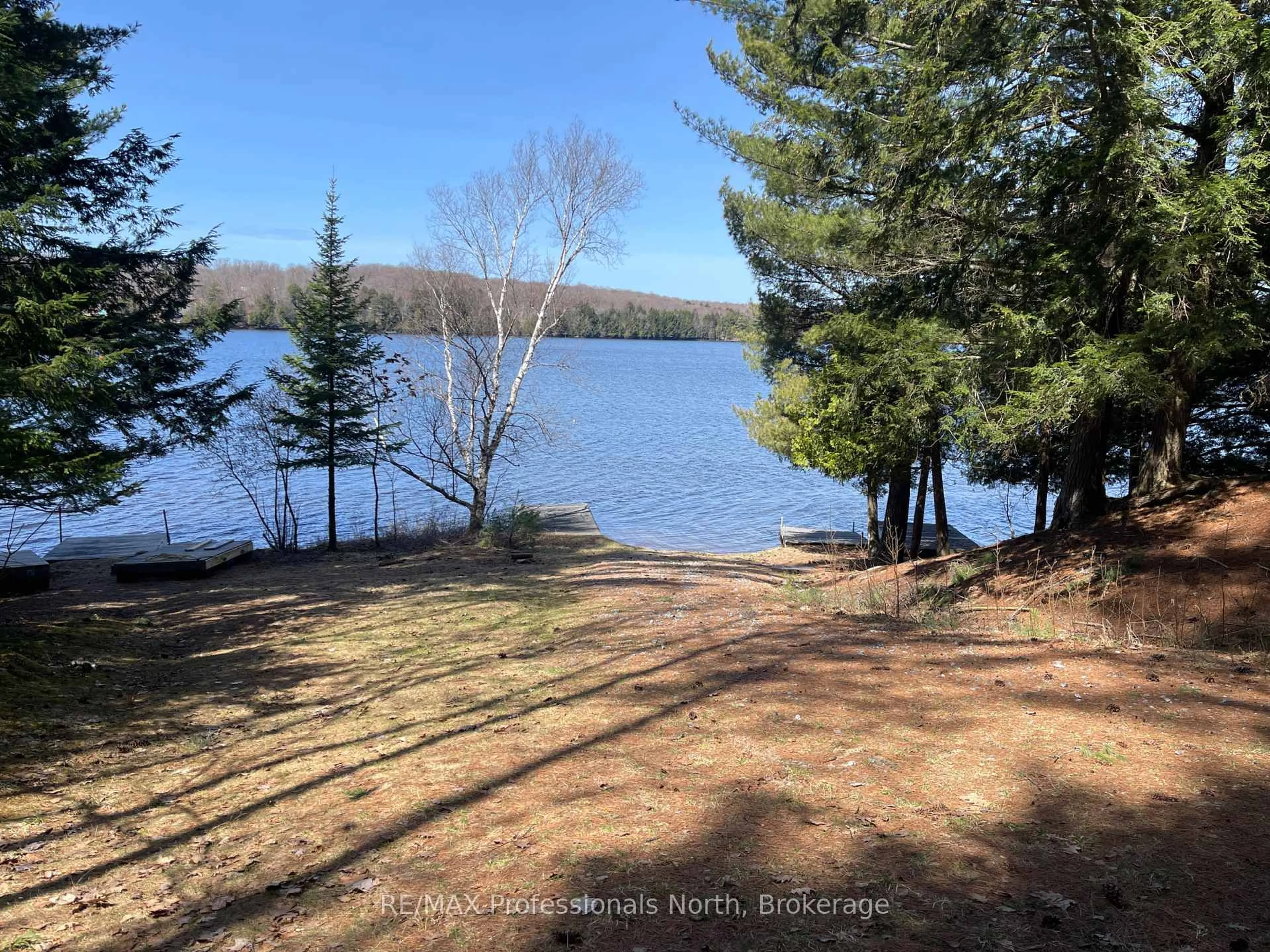 A pic from outside/outdoor area/front of a property/back of a property/a pic from drone, water/lake/river/ocean view for 1158-8 Clearwater Lake Rd, Huntsville Ontario P0B 1L0