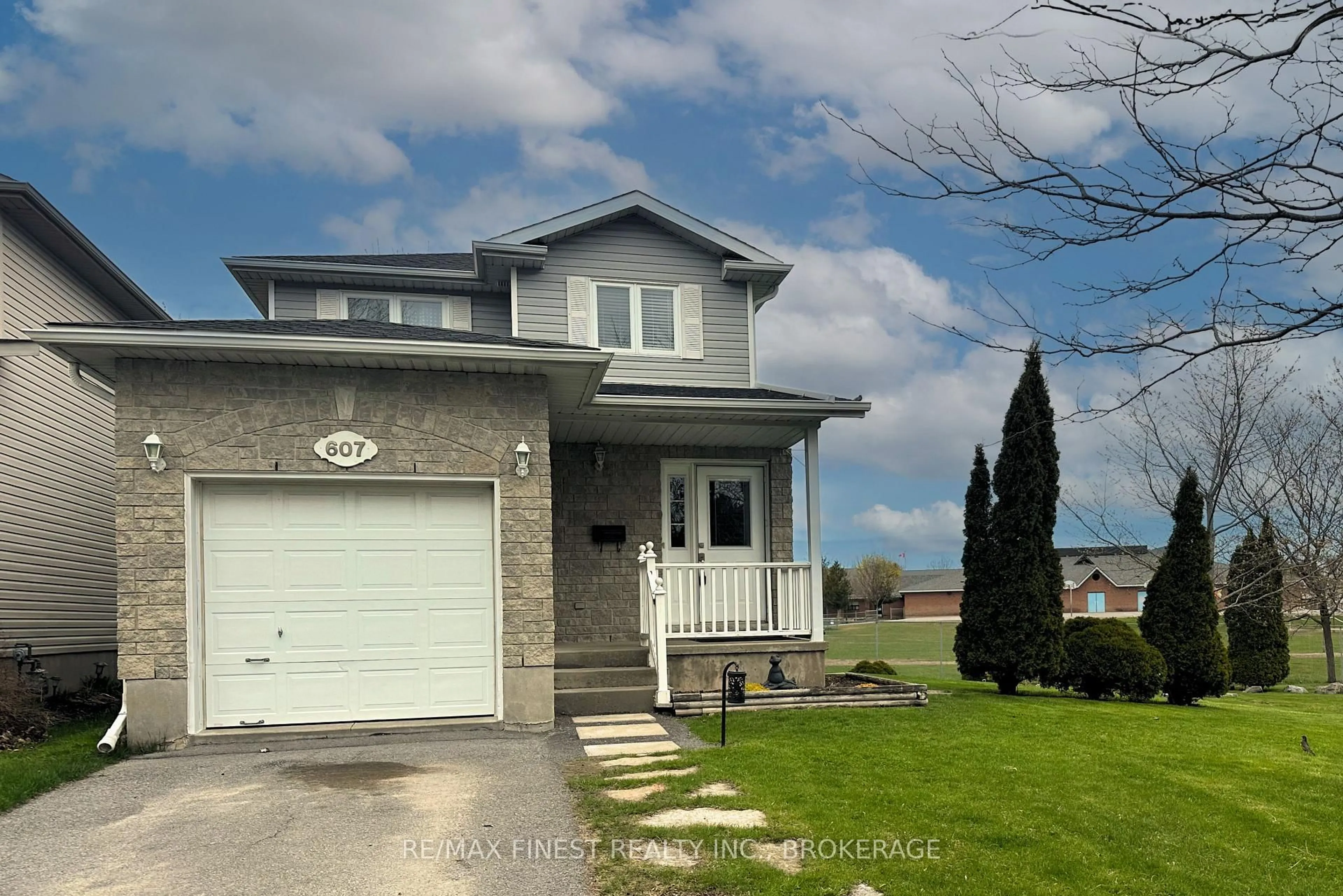 Home with vinyl exterior material, street for 607 Heritage Crt, Kingston Ontario K7M 9C9