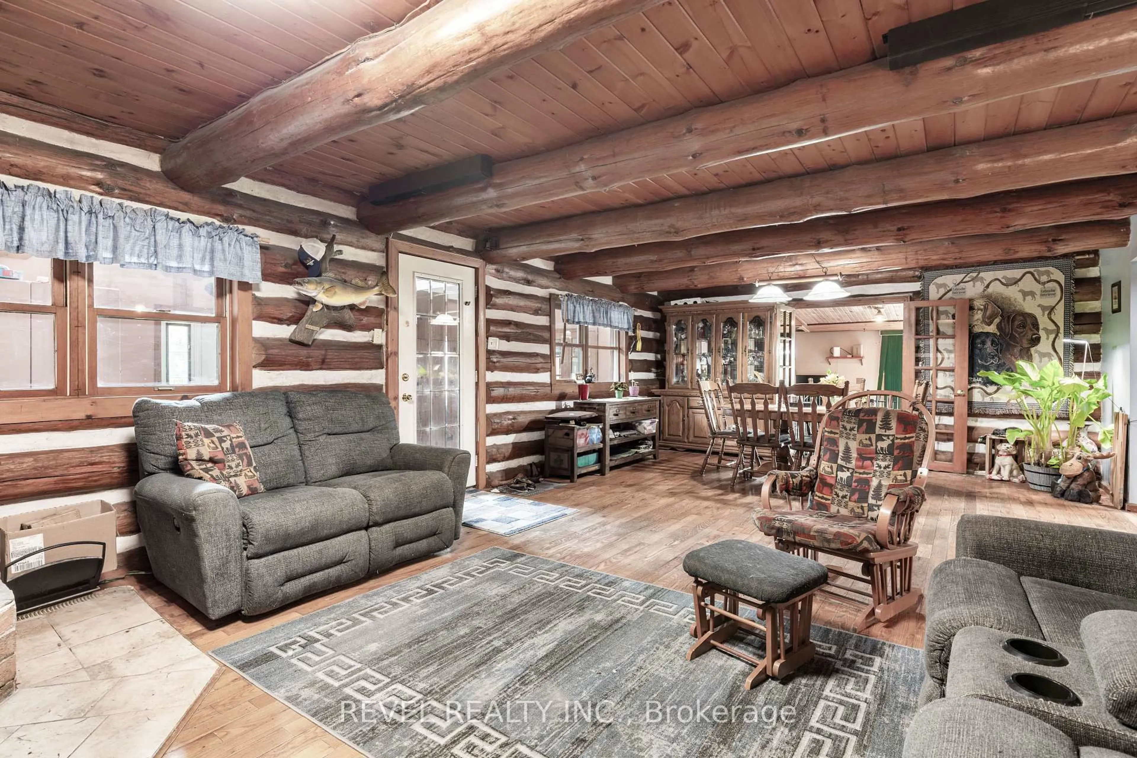 Living room with furniture, wood/laminate floor for 152 Pleasant Pt Rd, Kawartha Lakes Ontario K0M 1L0